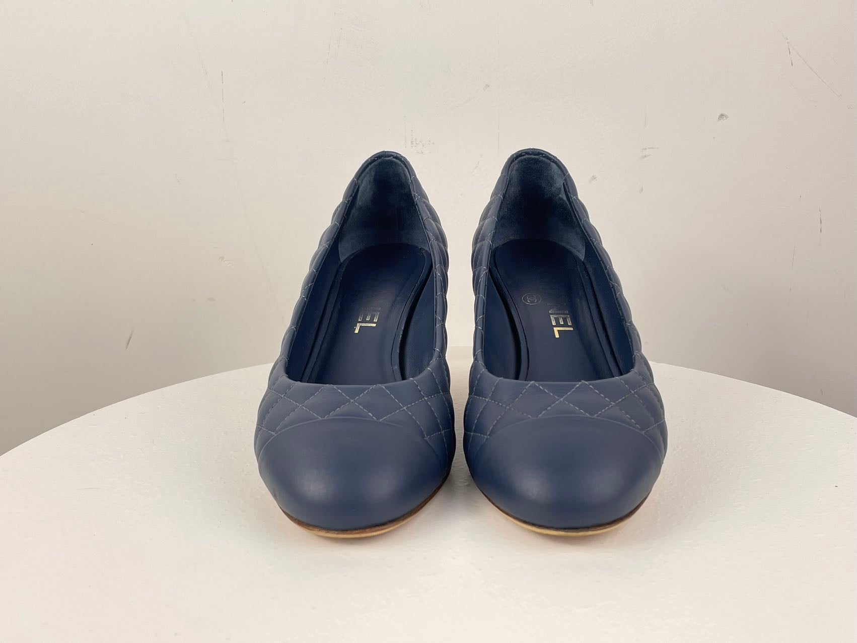 Chanel Navy Black Calfskin Quilted Cap Toe Camellia Pumps 37.5 with Cc Logo