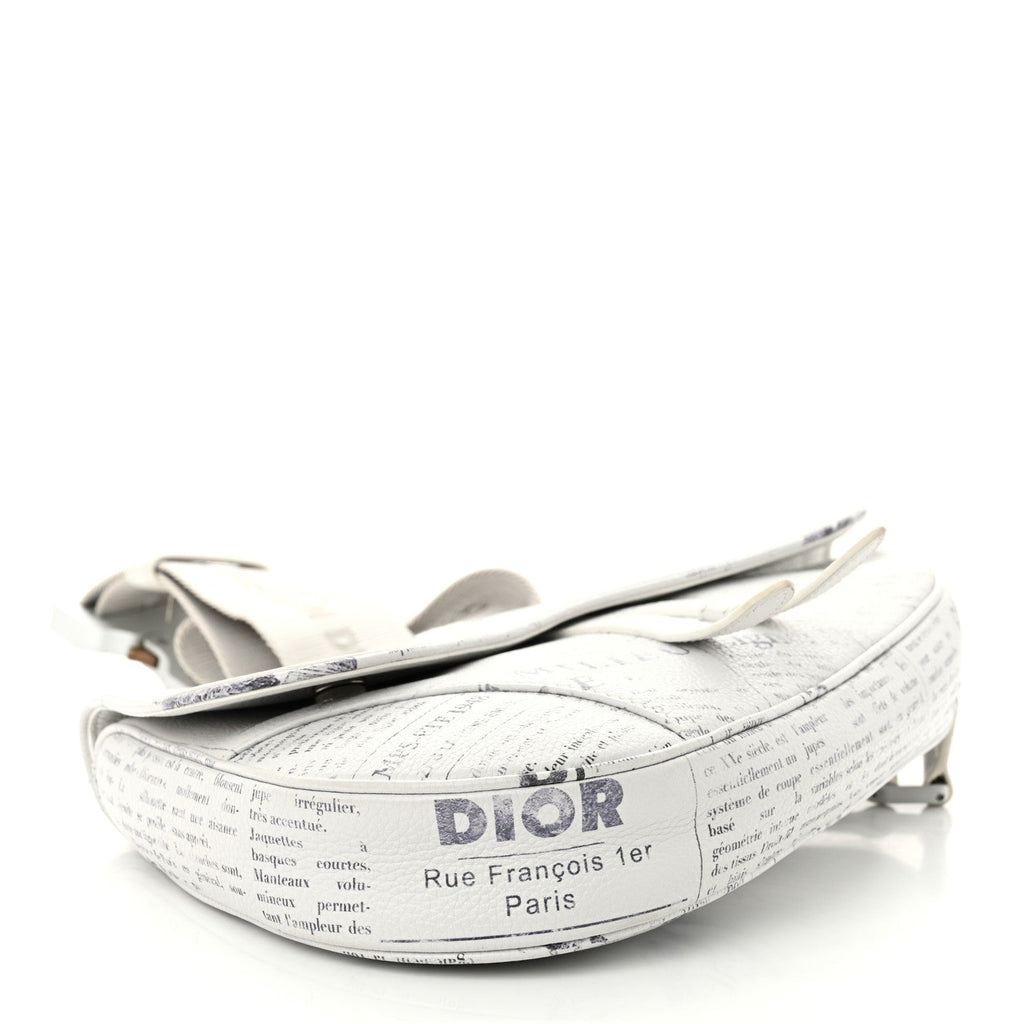 X DANIEL ARSHAM Grained Calfskin Newspaper Print Saddle Bag White