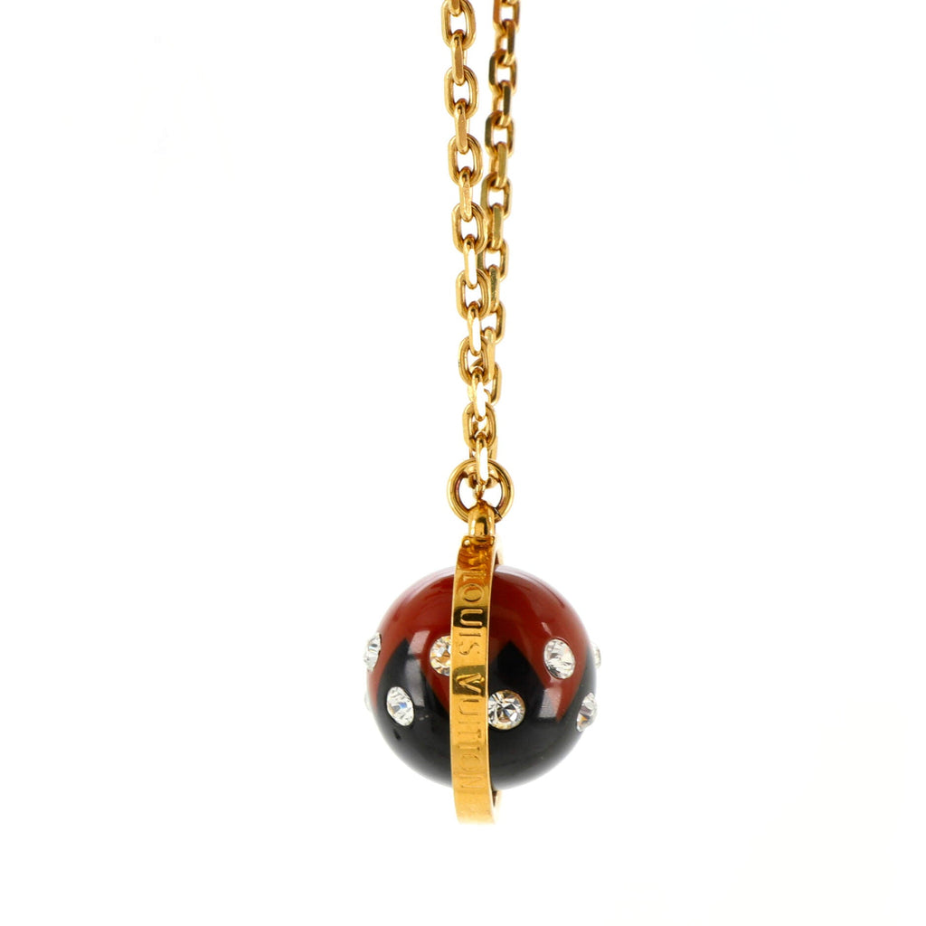 Spinning Sphere Pendant Necklace Metal and Crystal Embellished Resin