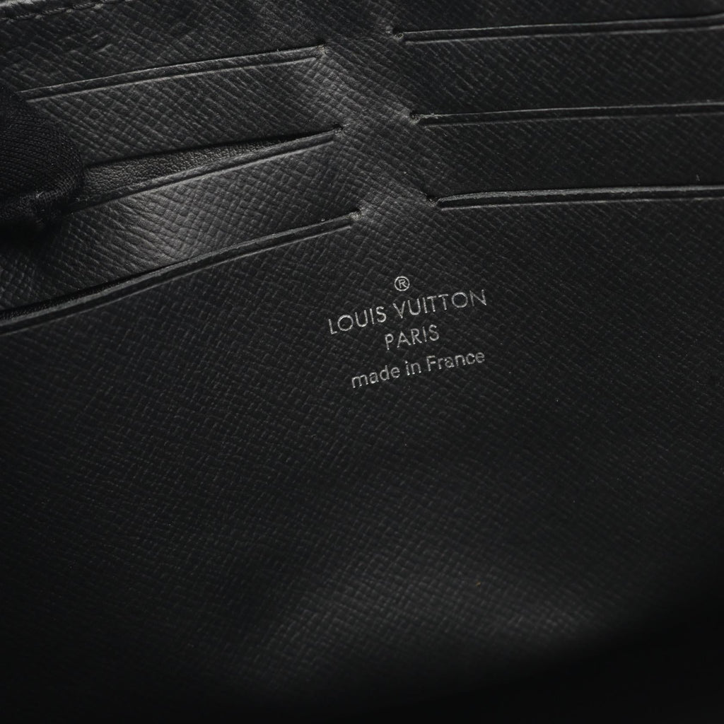 Louis Vuitton Pochette Voyage Taiga Clutch Bag