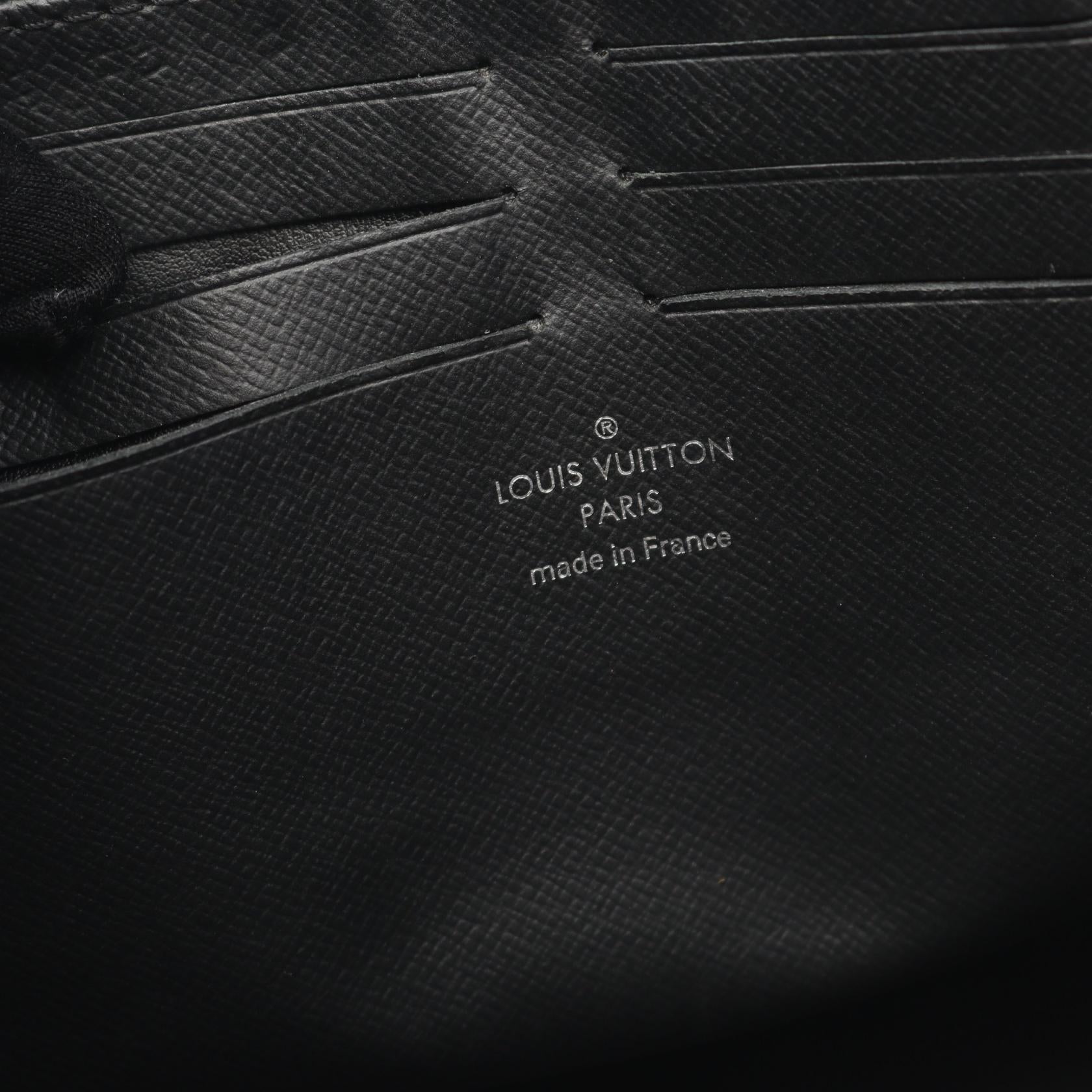 Louis Vuitton Pochette Voyage Taiga Clutch Bag