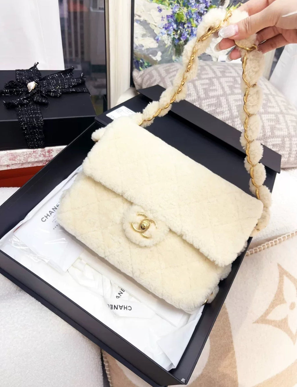 Chanel 24K off-white shearling chain flap bag with gold hardware