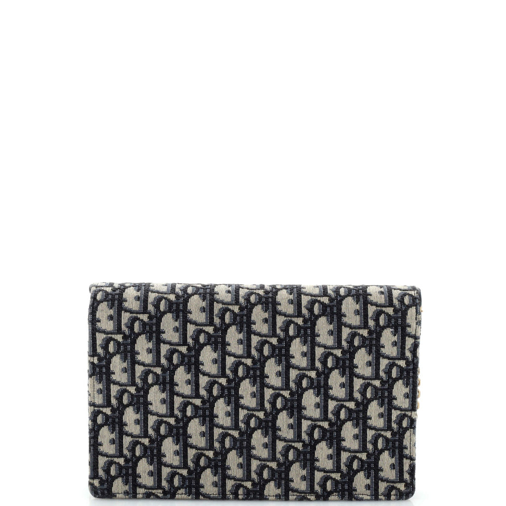 Saddle Chain Clutch Oblique Canvas
