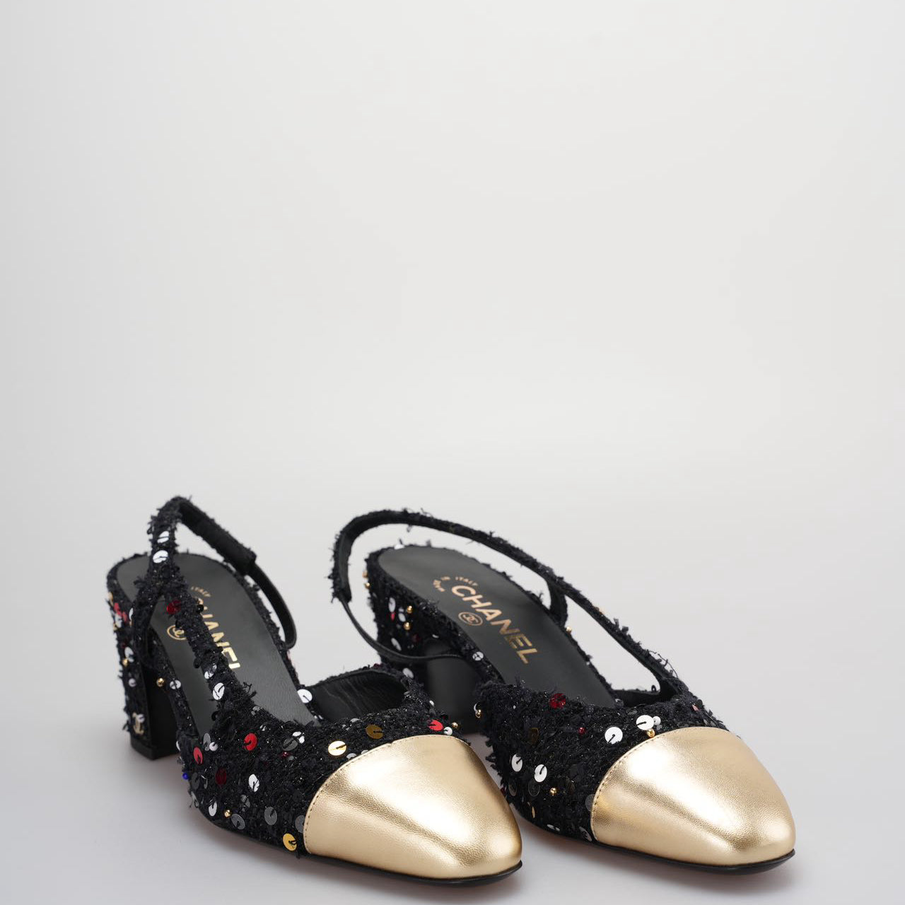 Chanel Tweed Lambskin Sequin Cap Toe CC Slingback Pumps size 39 in Black and Gold