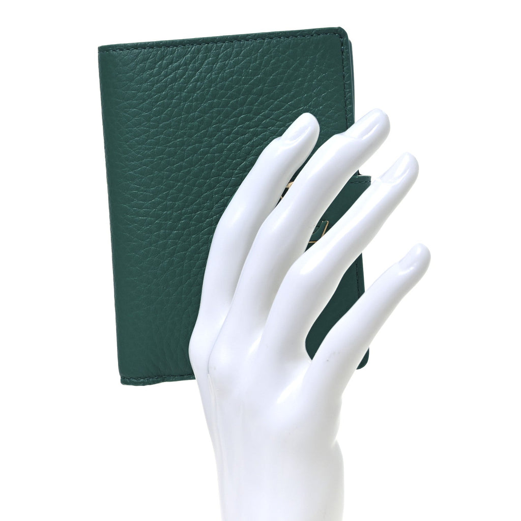 Taurillon Capucines Vertical Compact Wallet Green