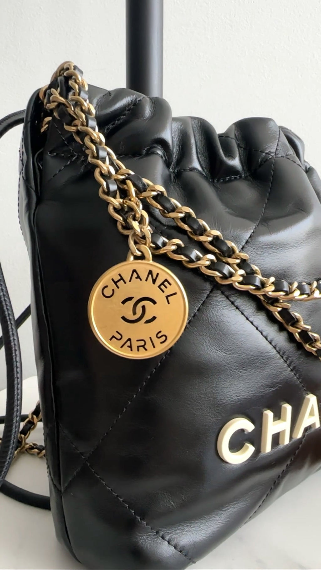 Chanel 2023 Black Leather Chain 22 Mini Bag with Ivory Enamel Logo