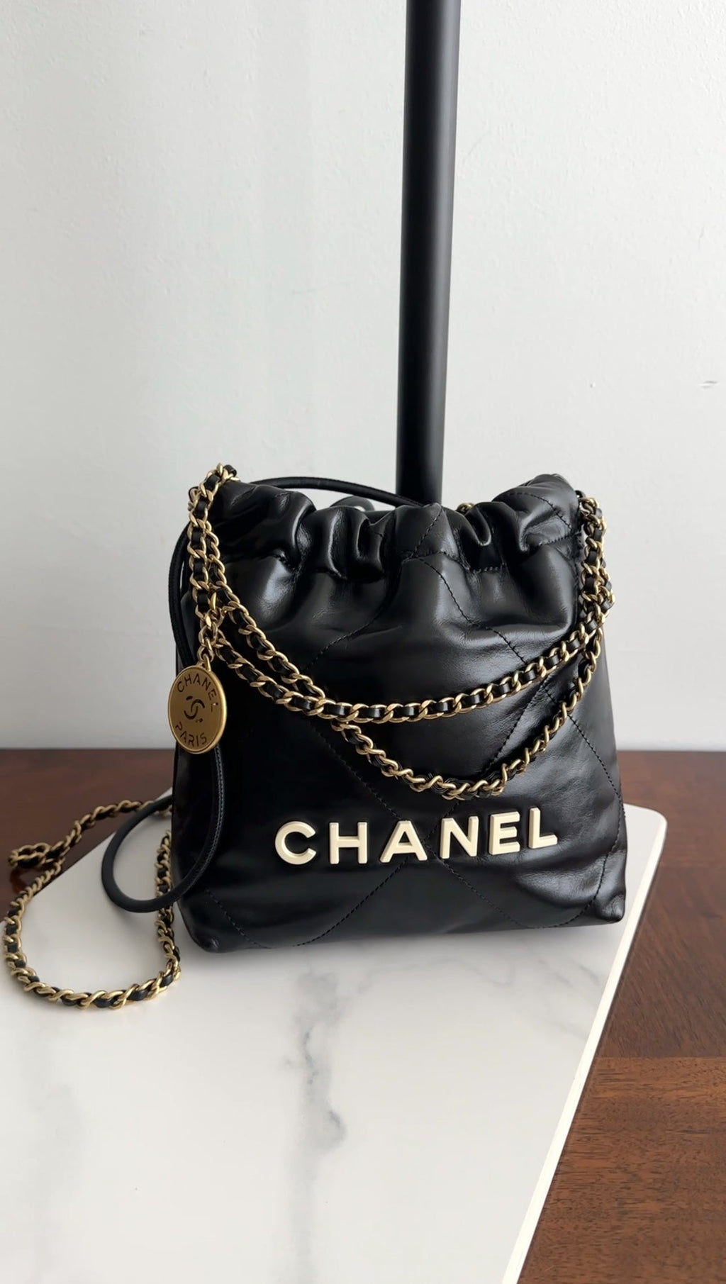 Chanel 2023 Black Leather Chain 22 Mini Bag with Ivory Enamel Logo