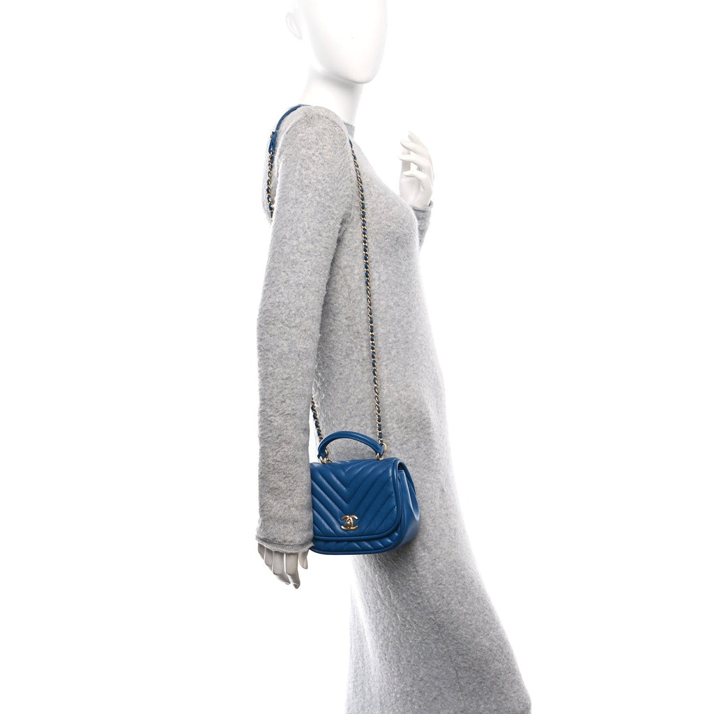 Lambskin Reverse Chevron Quilted Mini Round Top Handle Flap Blue
