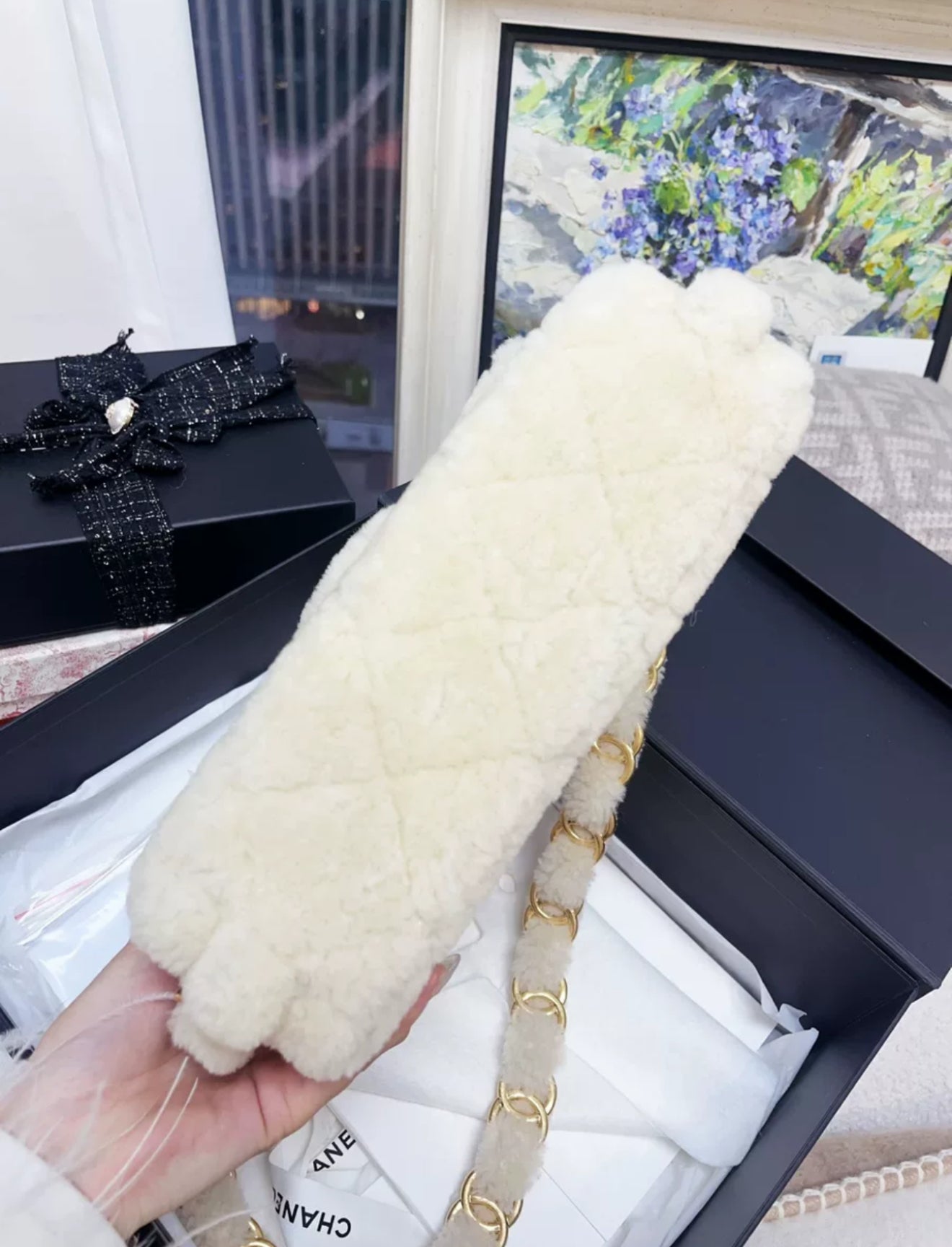 Chanel 24K off-white shearling chain flap bag with gold hardware