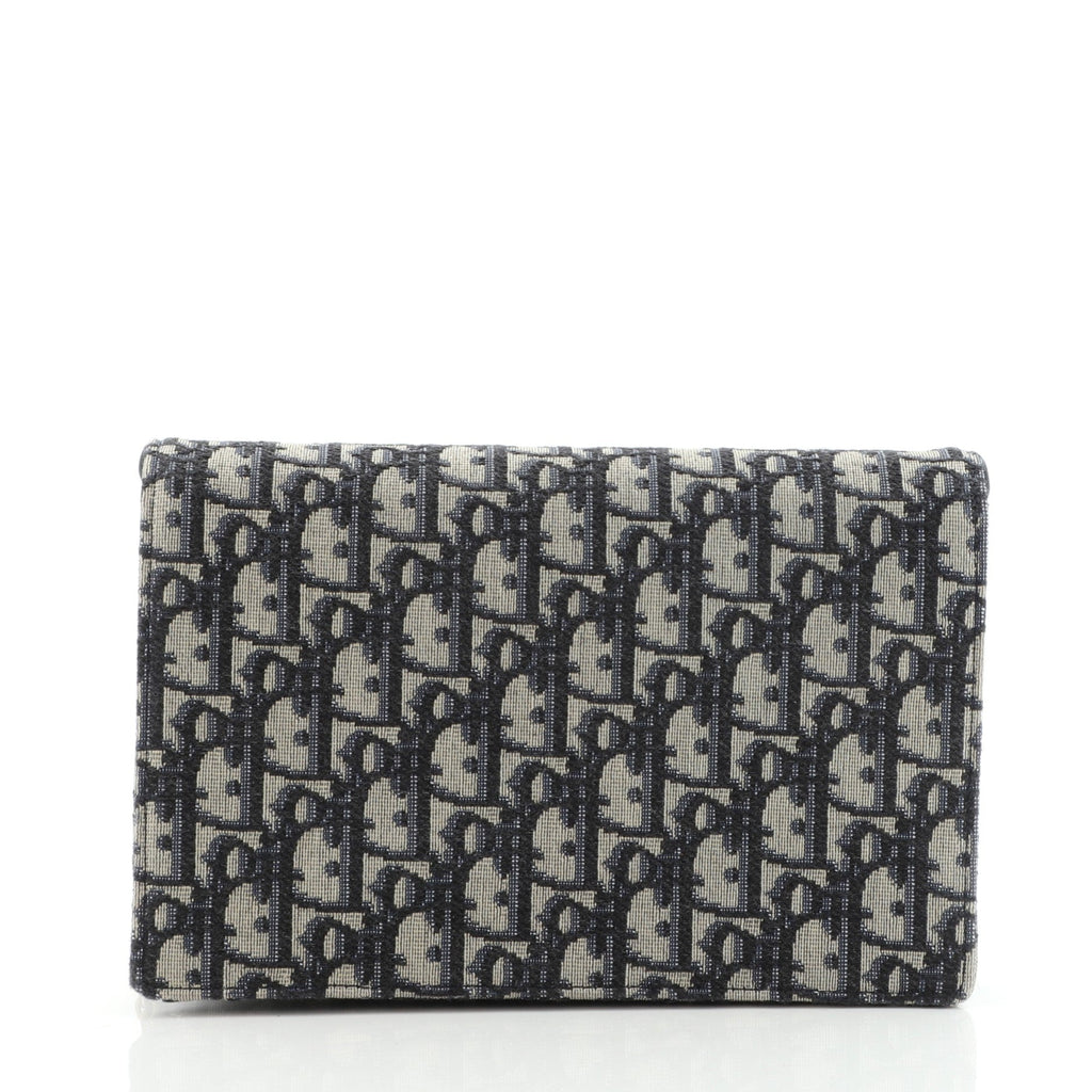 Saddle Chain Clutch Oblique Canvas