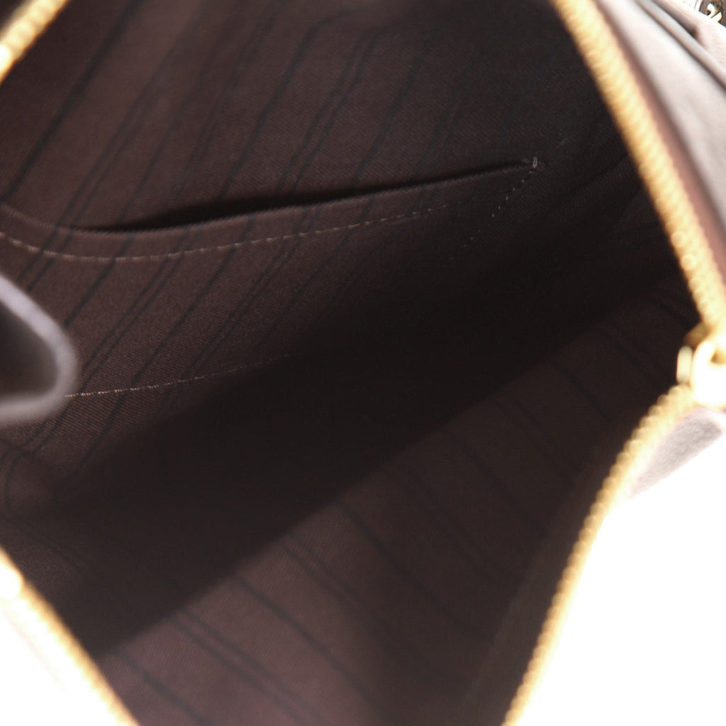 Petillante Clutch Monogram Empreinte Leather