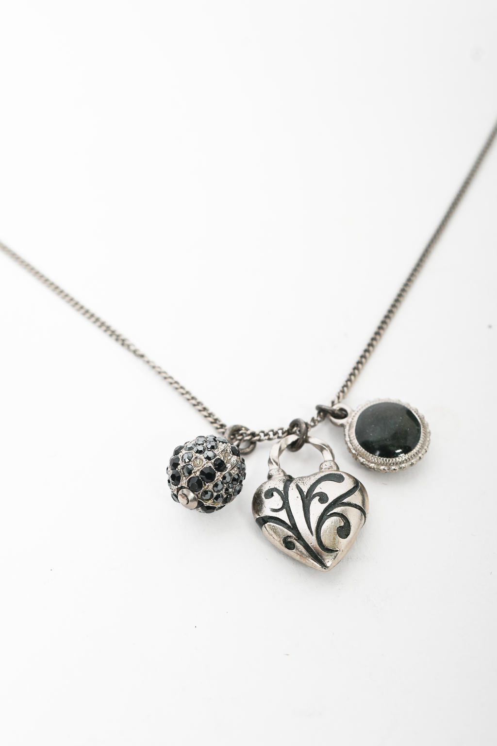 Pre-loved Chanel™ 2009 Silver Tone Heart Shaped CC Charmed Necklace