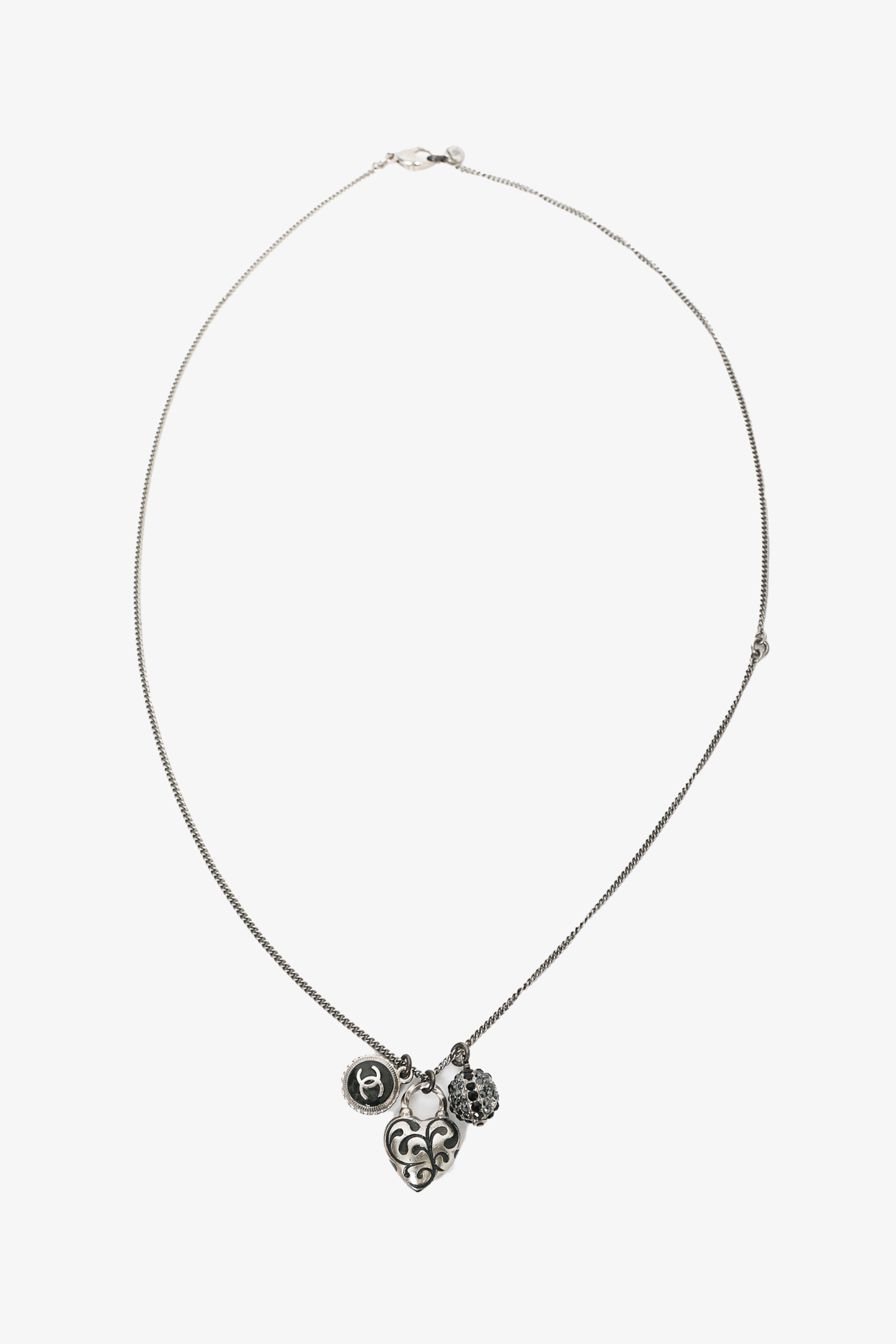 Pre-loved Chanel™ 2009 Silver Tone Heart Shaped CC Charmed Necklace