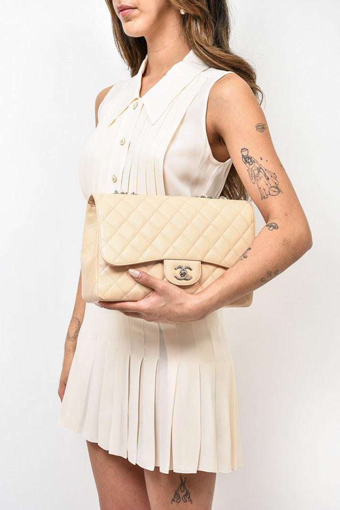 Pre-loved Chanel™ 2010/11 Beige Caviar Leather Jumbo Classic Flap Bag