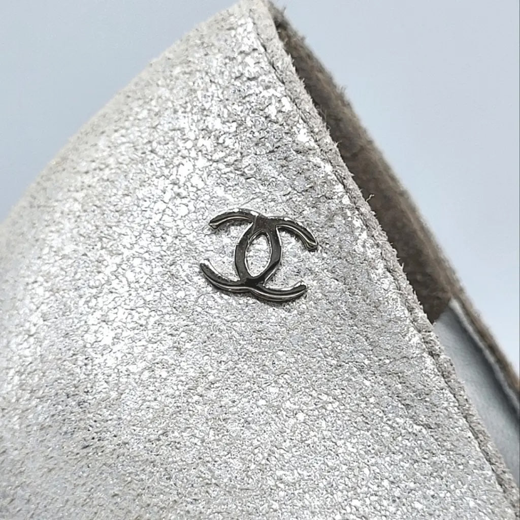 CHANEL METALLIC SILVER CC CAP TOE PUMPS