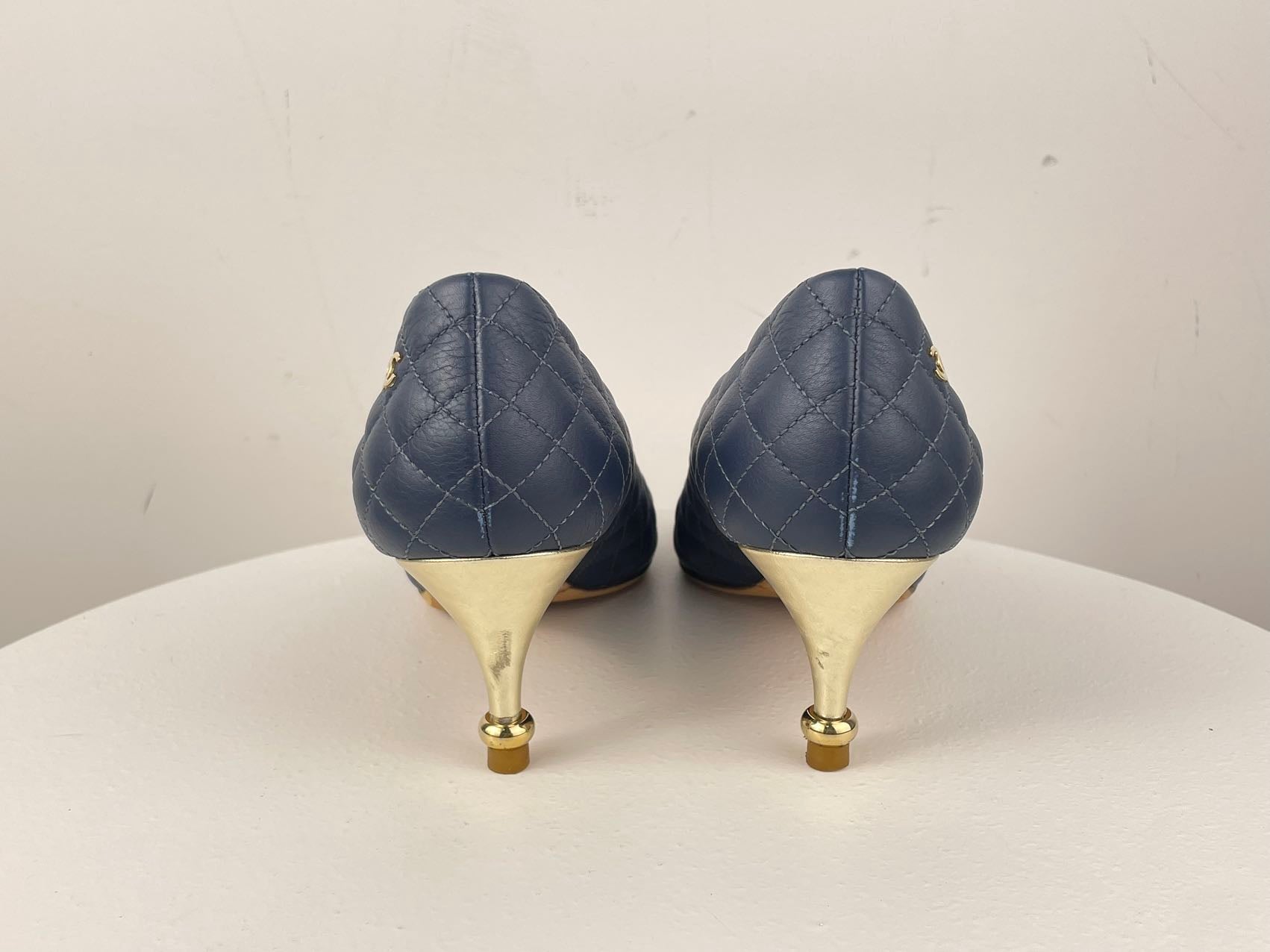 Chanel Navy Black Calfskin Quilted Cap Toe Camellia Pumps 37.5 with Cc Logo