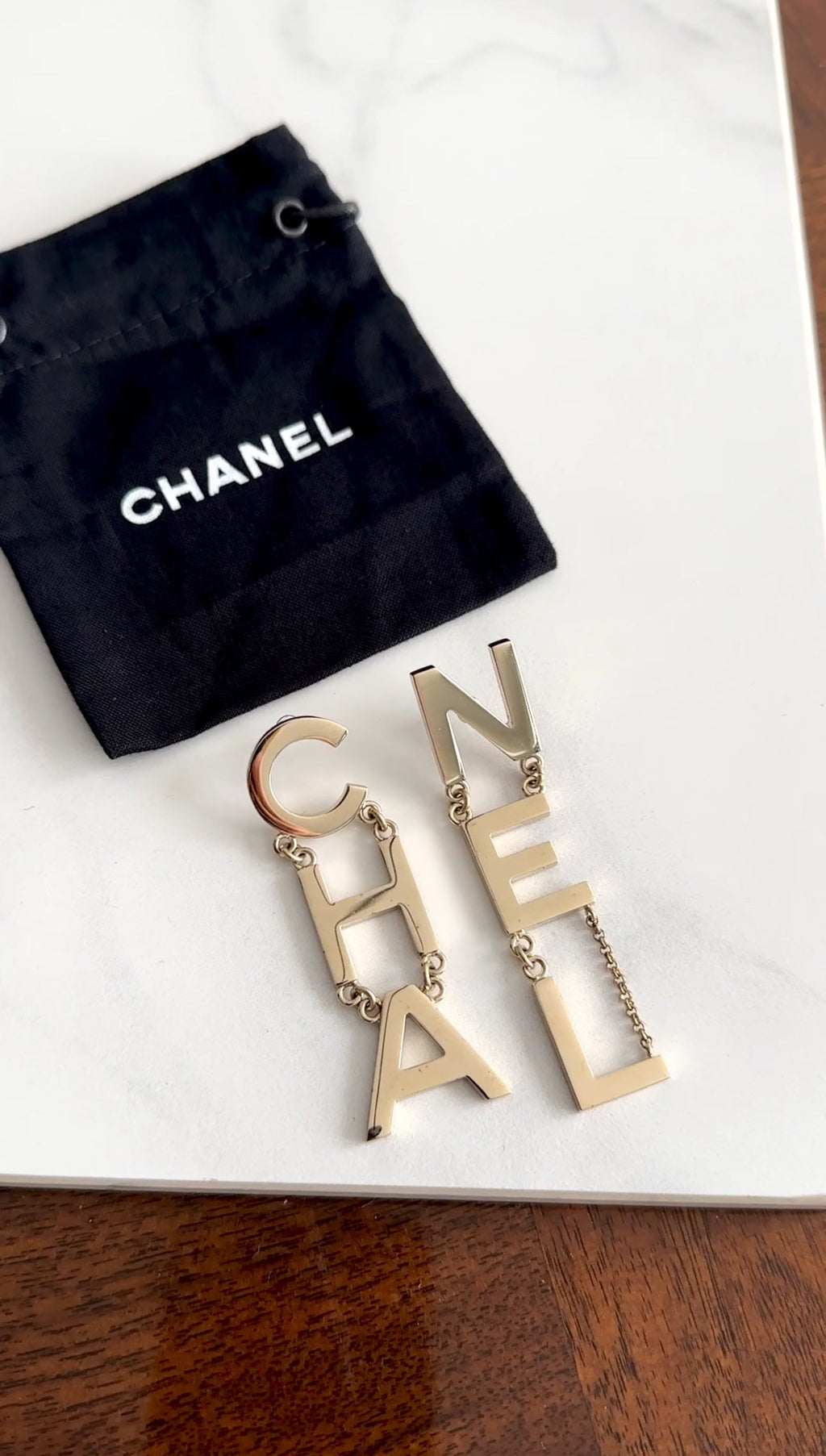 Chanel 19S Light Goldtone Spellout Logo Drop Earrings