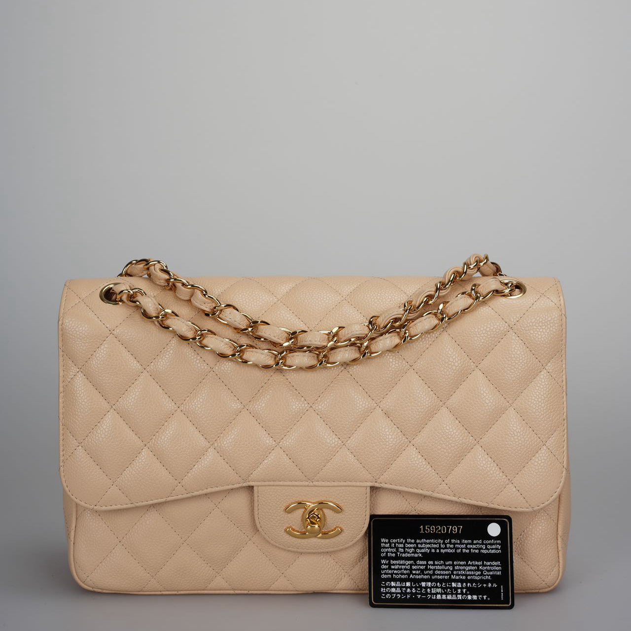Chanel Classic Double Flap Bag Jumbo in Beige Quilted Caviar Leather with Gold Hardware