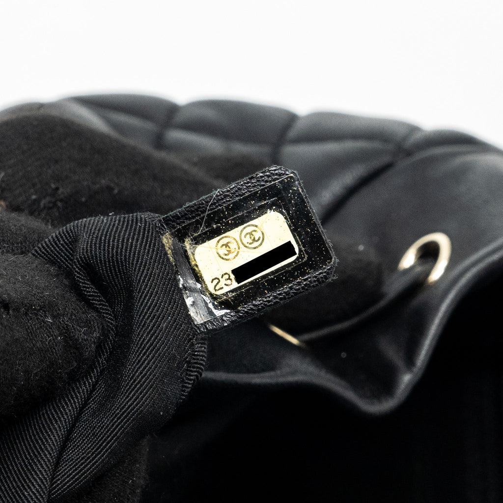 Chanel quilted flap backpack lambskin black