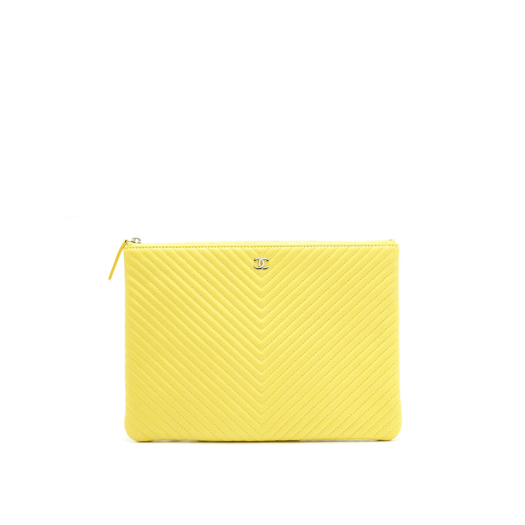 CHANEL CHEVRON CLUTCH BAG IN YELLOW