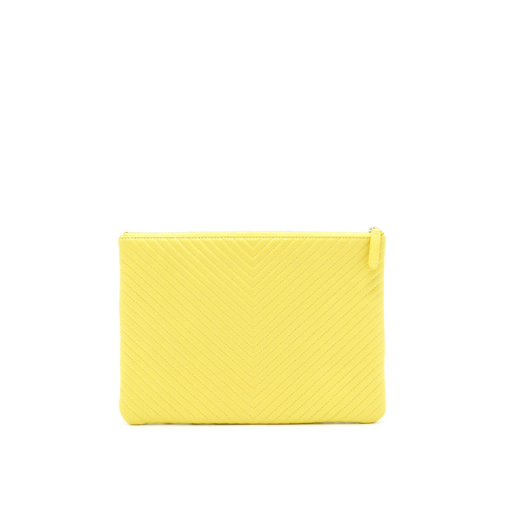 CHANEL CHEVRON CLUTCH BAG IN YELLOW
