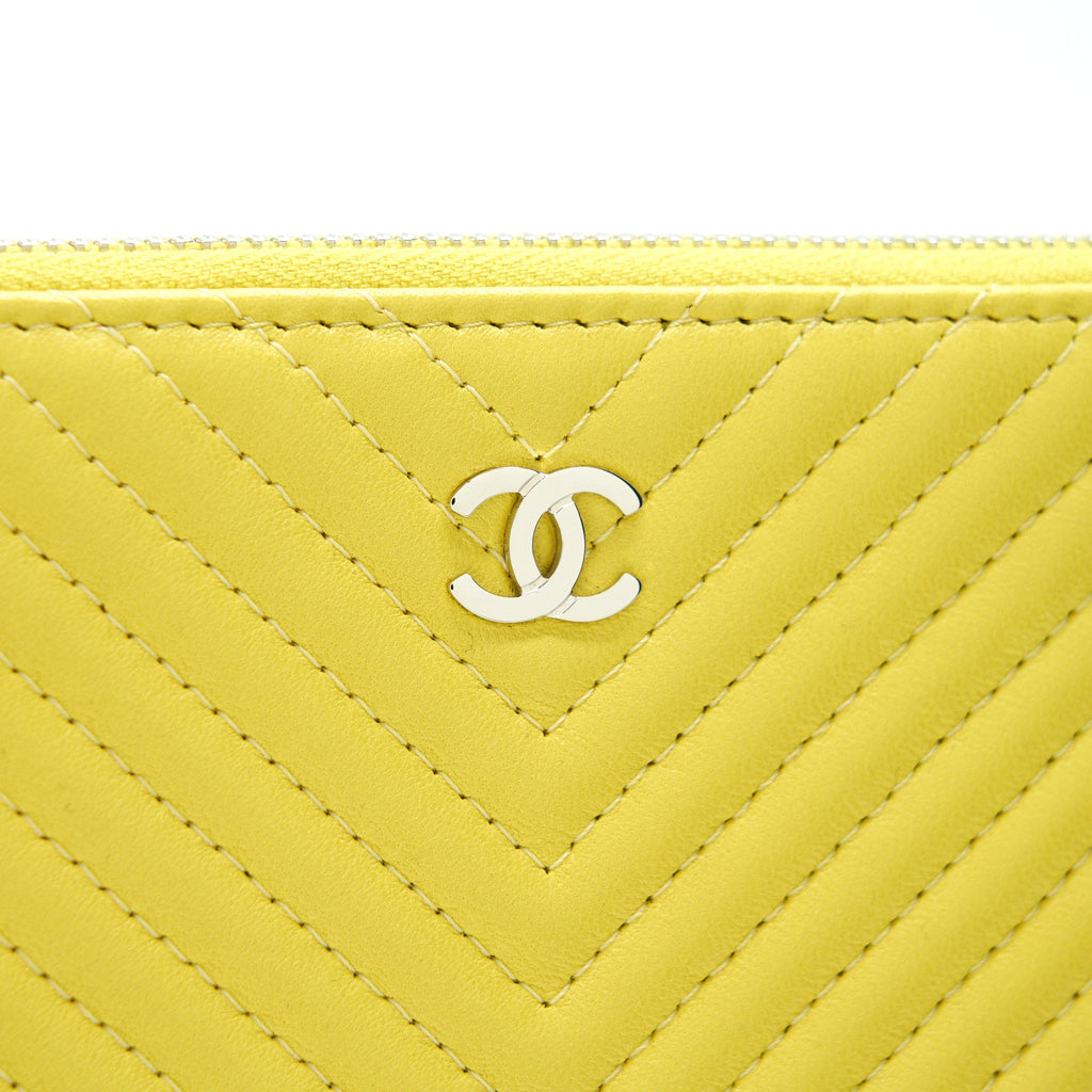 CHANEL CHEVRON CLUTCH BAG IN YELLOW