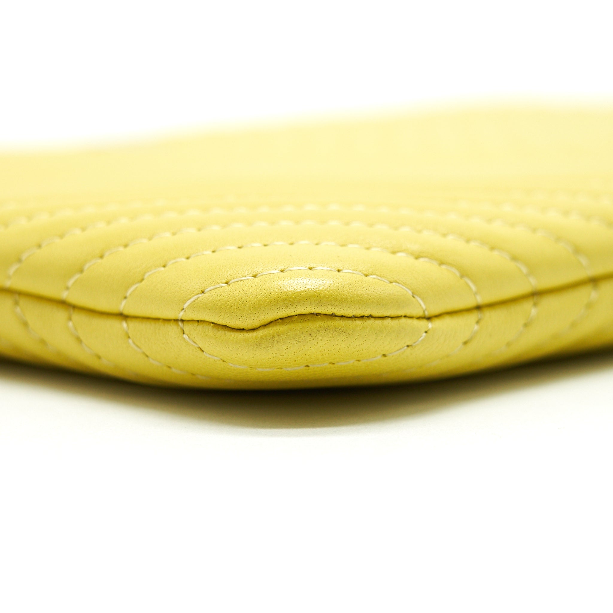 CHANEL CHEVRON CLUTCH BAG IN YELLOW