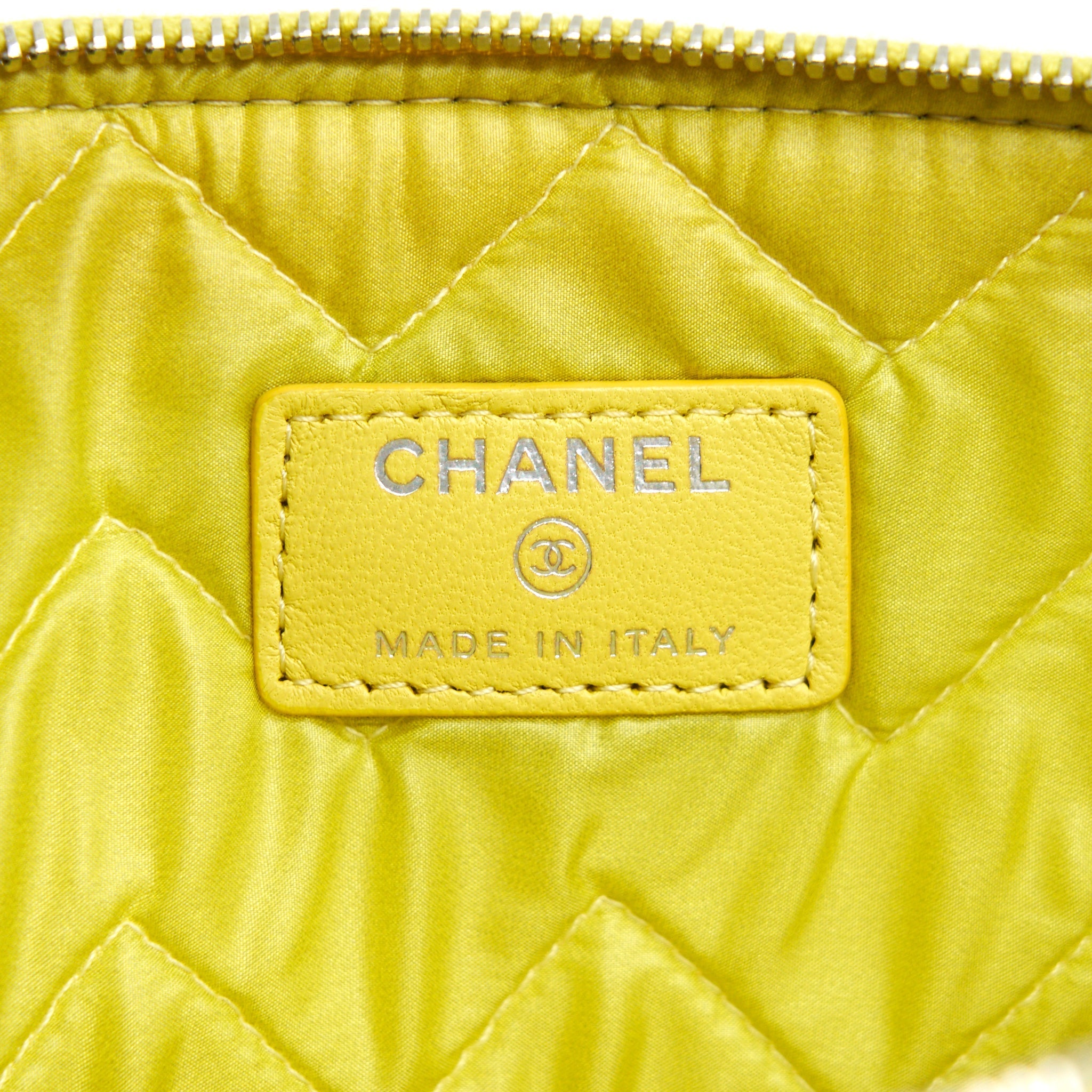 CHANEL CHEVRON CLUTCH BAG IN YELLOW