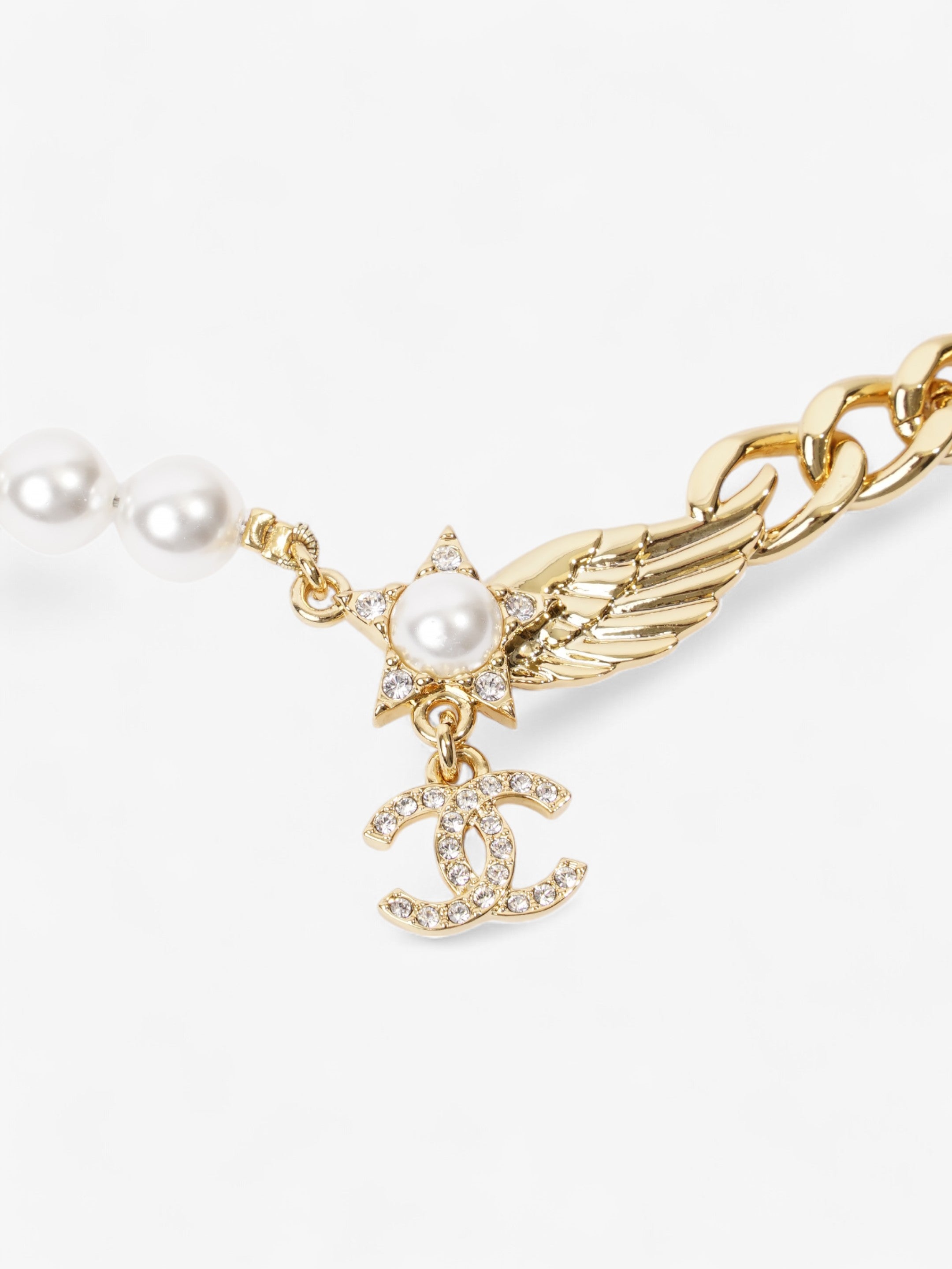 Chanel CC Star Wing Faux Pearl Choker Pearl / Gold Base Metal