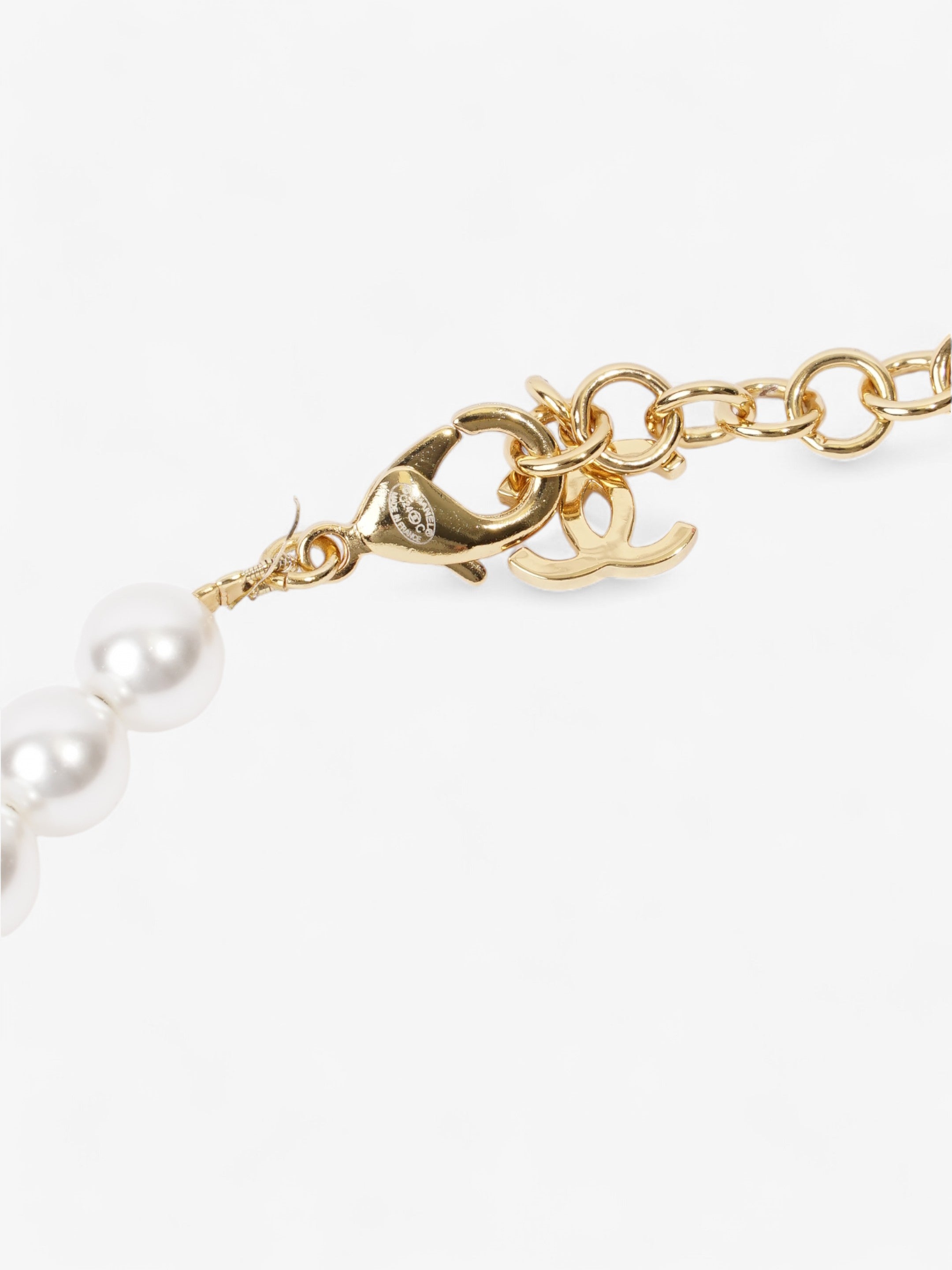 Chanel CC Star Wing Faux Pearl Choker Pearl / Gold Base Metal