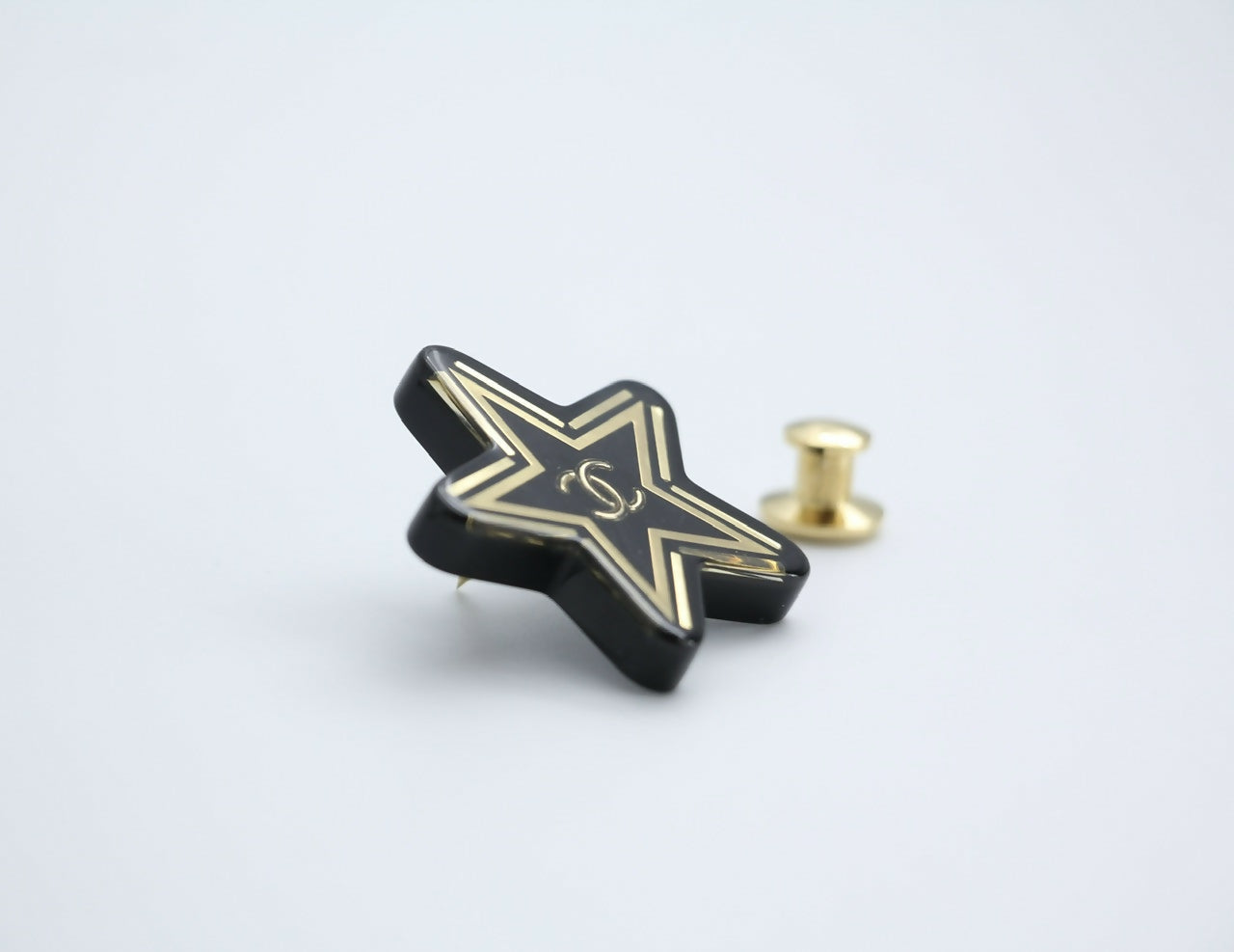 Chanel D21S Resin Black Gold Star Brooch