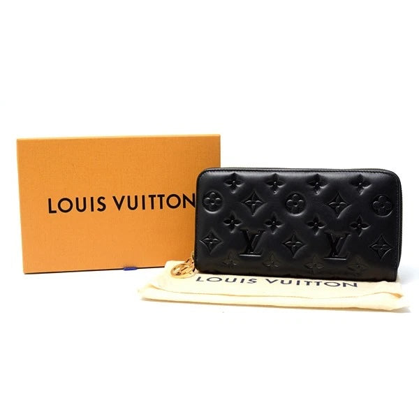 LOUIS VUITTON LAMBSKIN EMBOSSED MONOGRAM COUSSIN ZIPPY WALLET