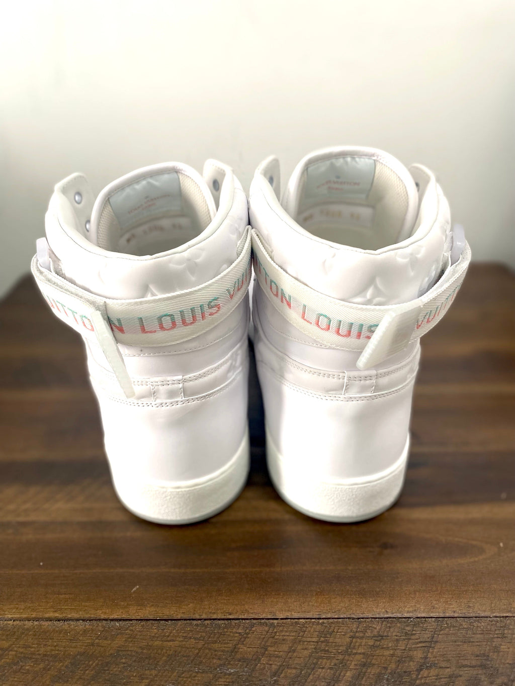 LOUIS VUITTON RIVOLI MONOGRAM LEATHER HI-TOP SNEAKERS