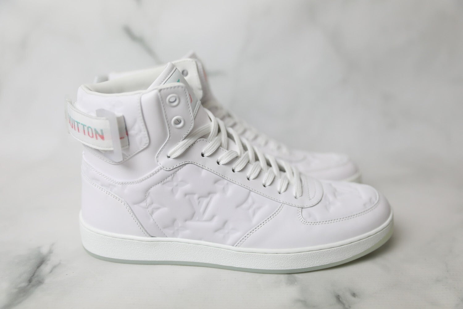 LOUIS VUITTON RIVOLI MONOGRAM LEATHER HI-TOP SNEAKERS