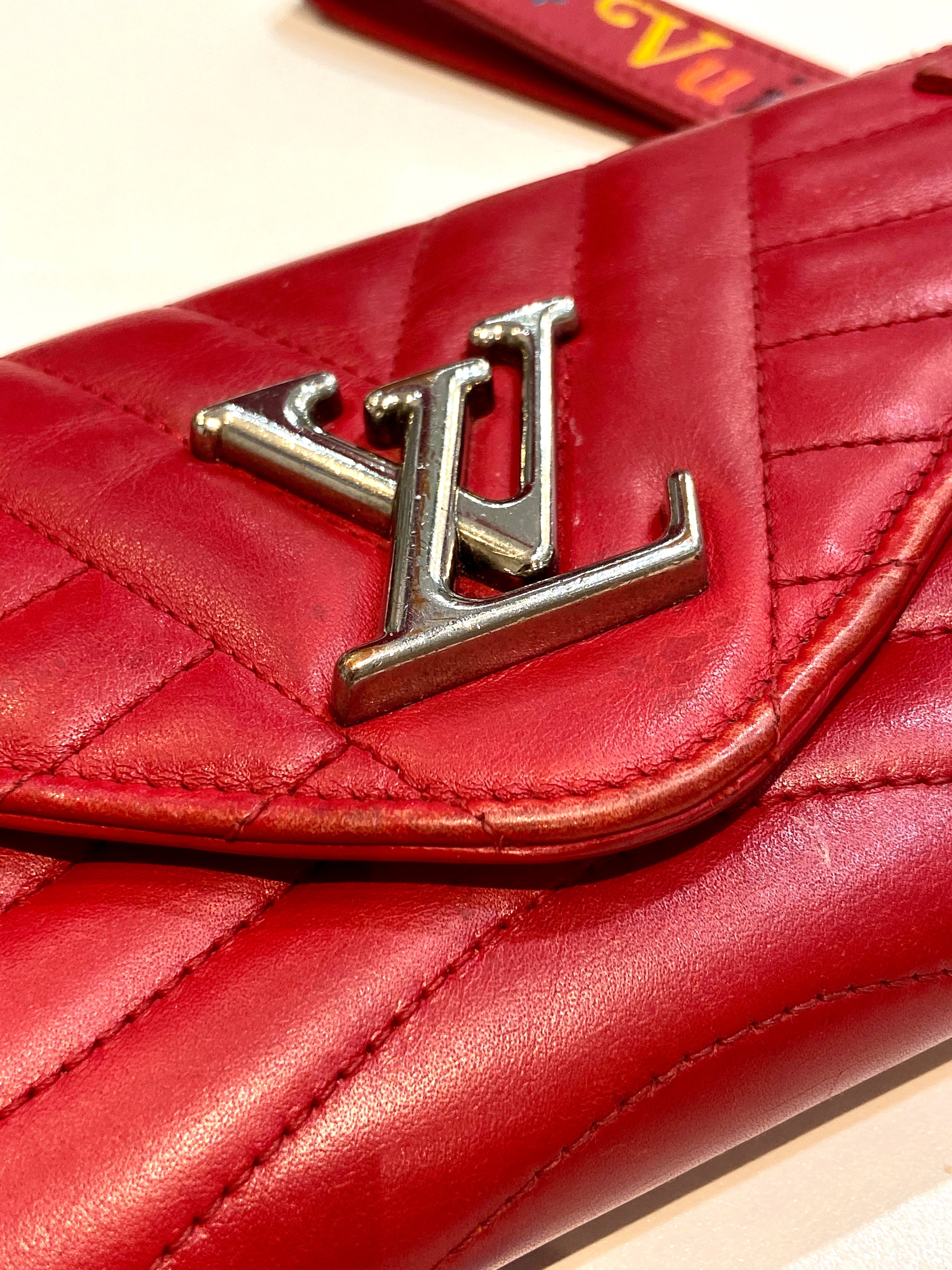 LOUIS VUITTON NEW WAVE LONG CALFSKIN WALLET WRISTLET