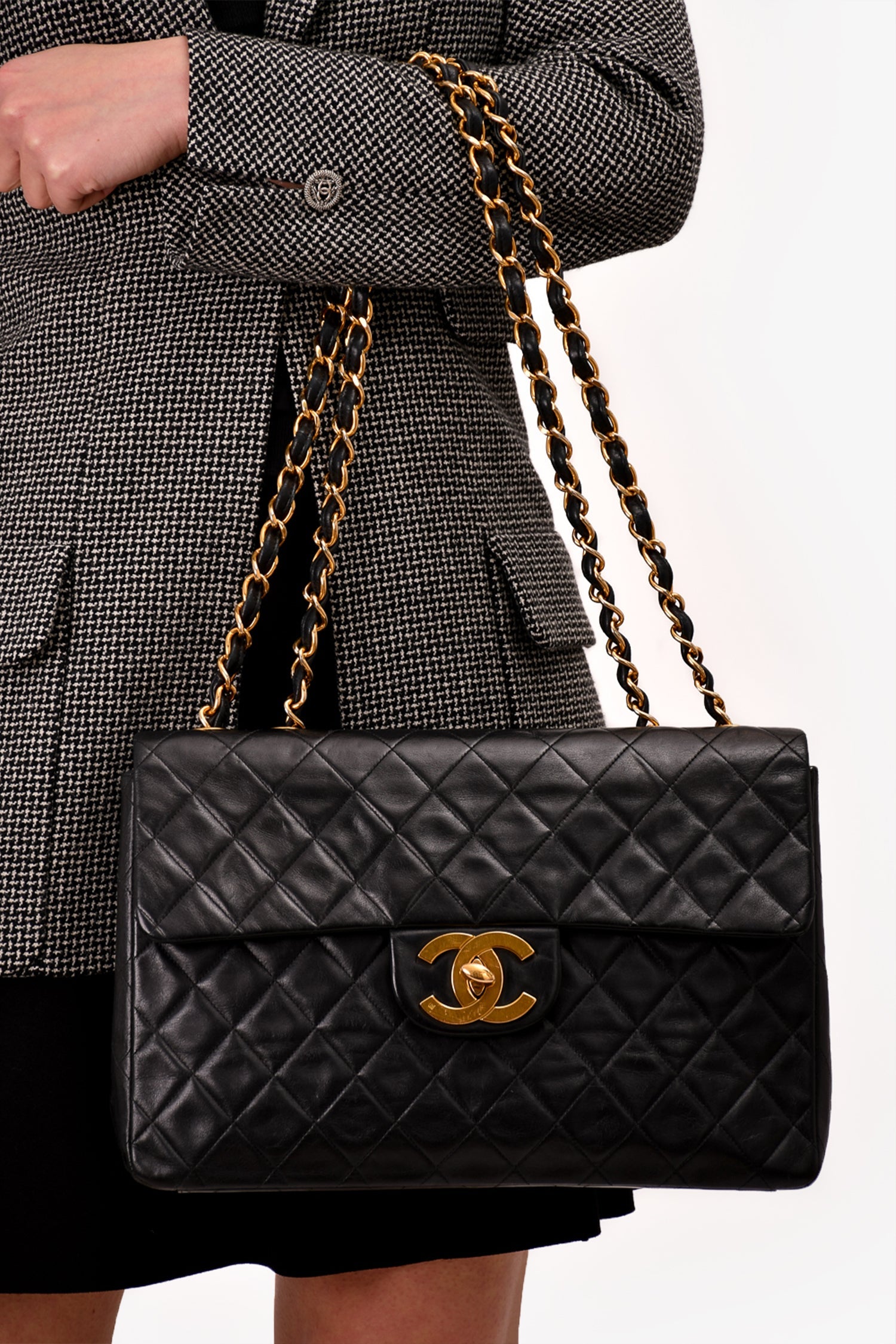 Pre-Loved Chanel™ Black Lambskin Jumbo XL Maxi Flap