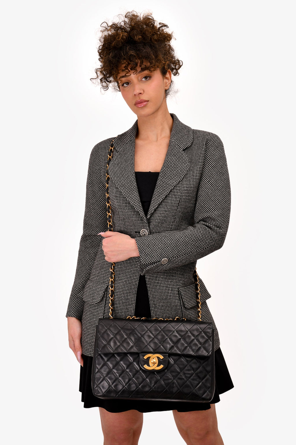 Pre-Loved Chanel™ Black Lambskin Jumbo XL Maxi Flap