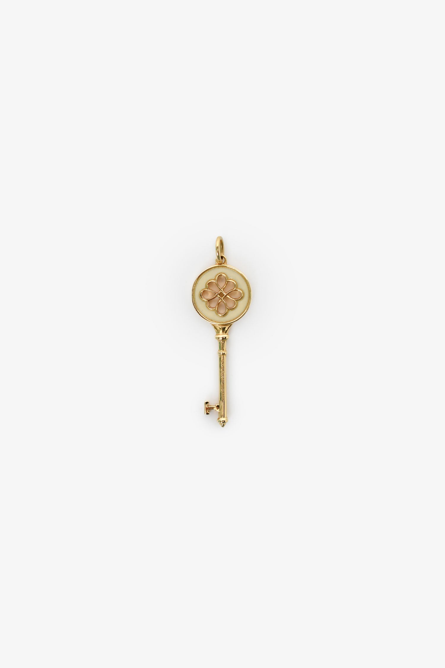 Tiffany & Co. 18K Yellow Gold White Enamel Knot Key Pendant