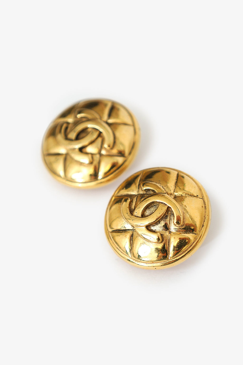 Pre-Loved Chanel™ Gold-tone Quilted Coco Mark Matelassé Round Clip-on Earrings