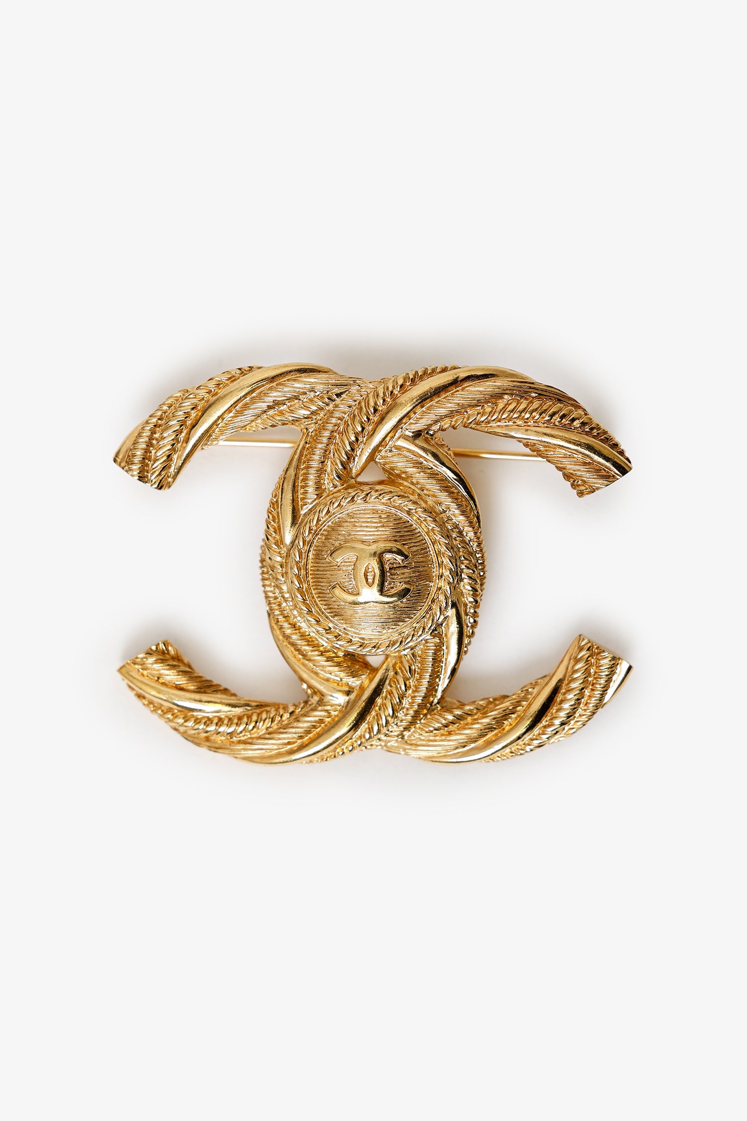 Pre-Loved Chanel™ Gold Tone Twisted CC Brooch