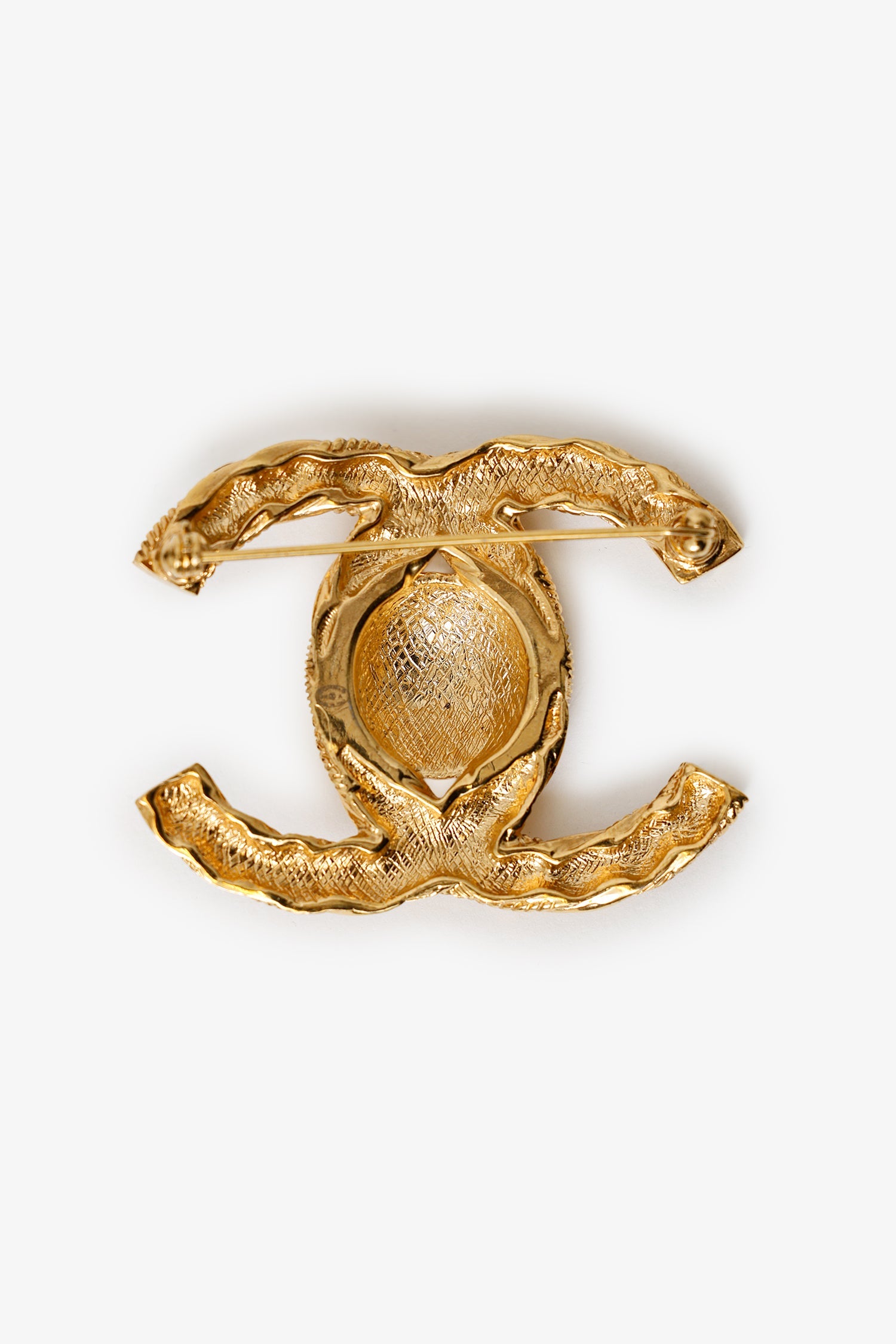 Pre-Loved Chanel™ Gold Tone Twisted CC Brooch