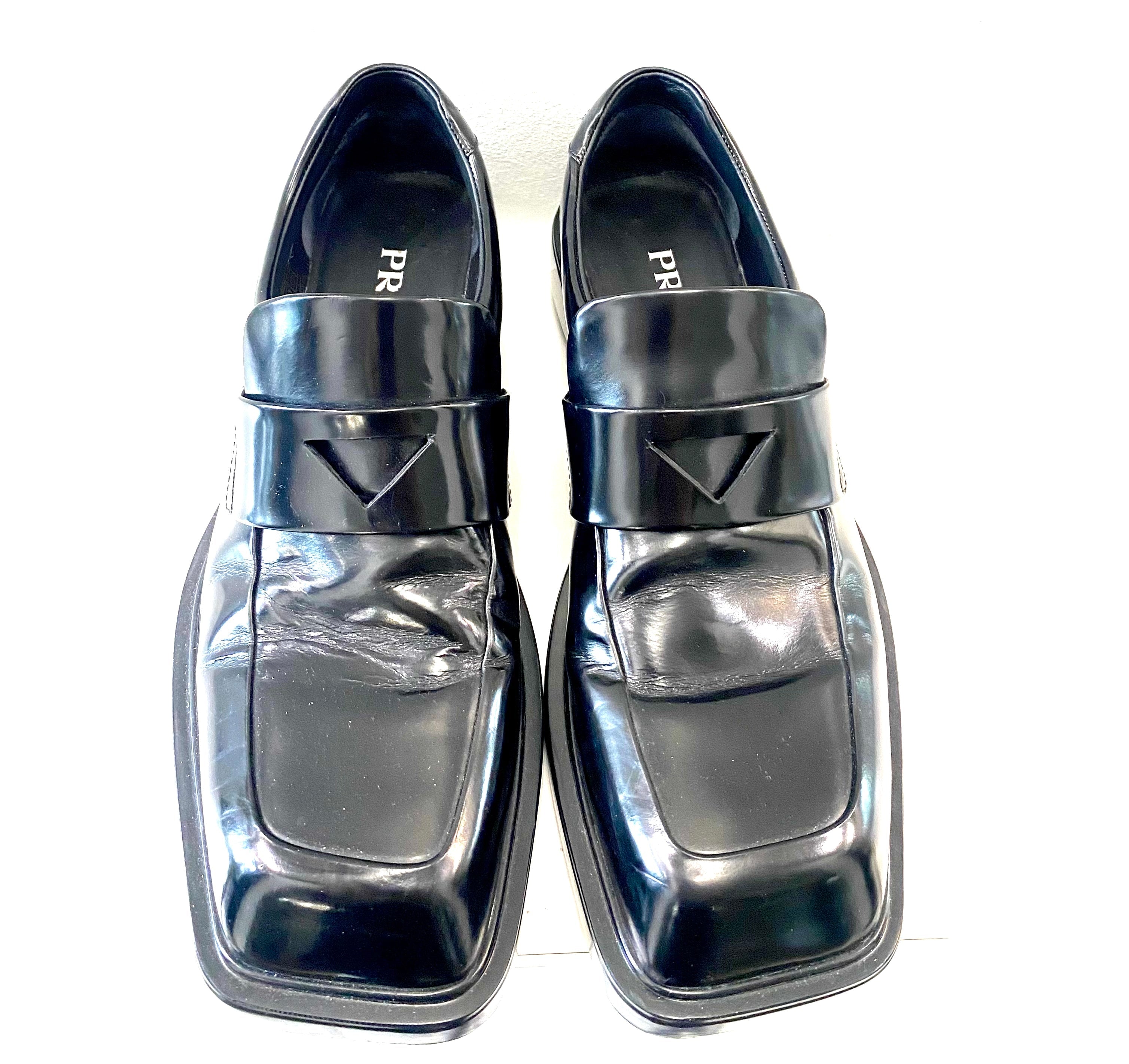 PRADA TRIANGLE LOGO PATCH SLIP-ON LOAFERS