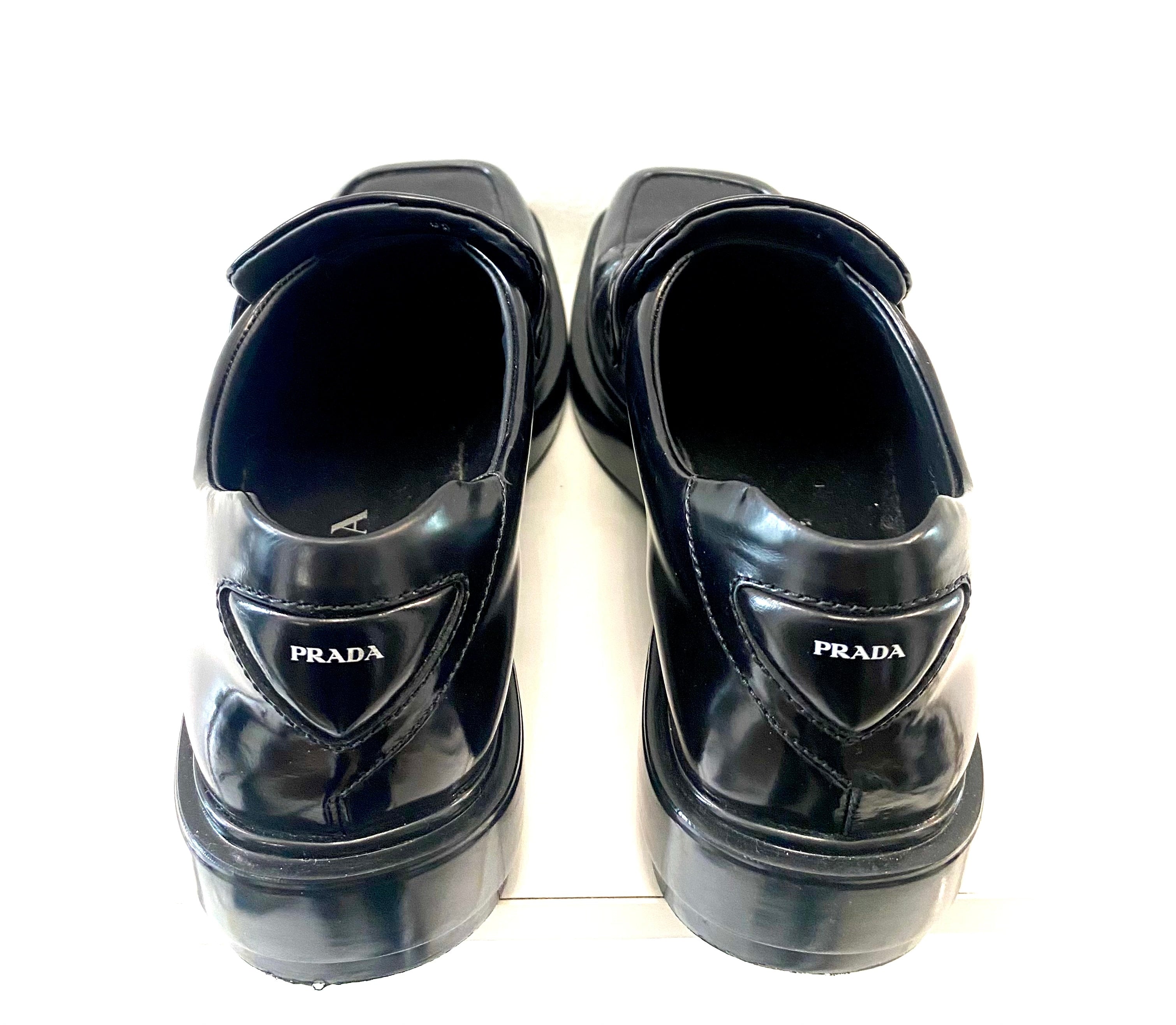 PRADA TRIANGLE LOGO PATCH SLIP-ON LOAFERS