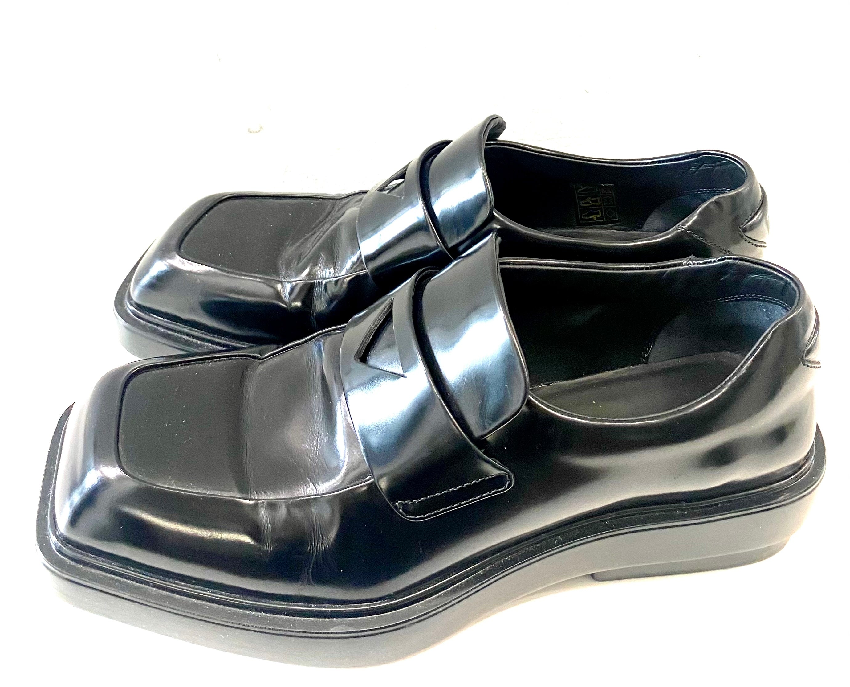 PRADA TRIANGLE LOGO PATCH SLIP-ON LOAFERS