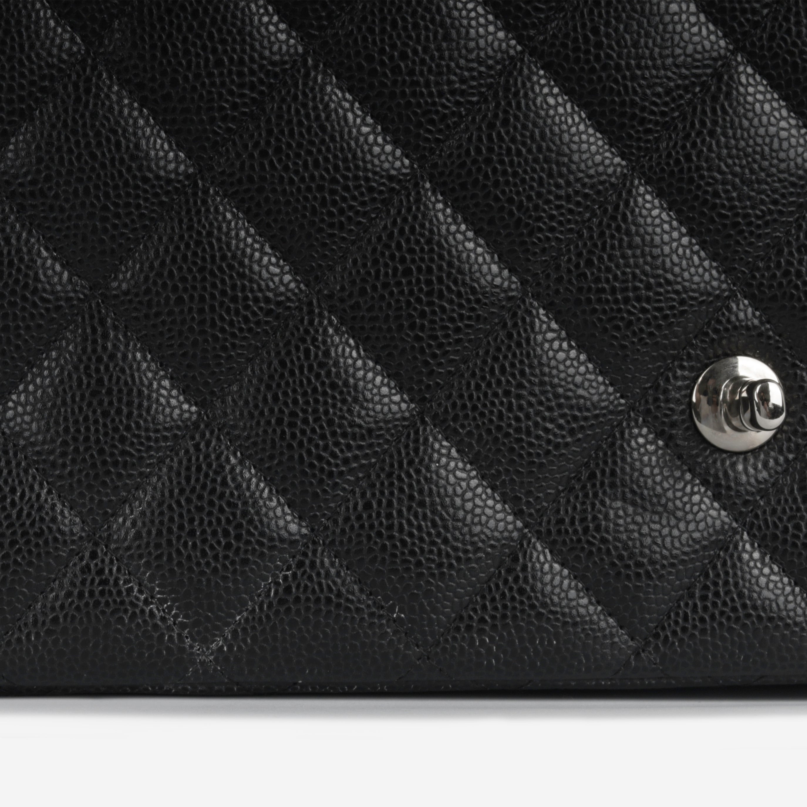 Chanel Maxi Classic Flap - Black Caviar