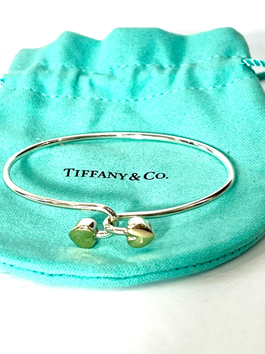 TIFFANY & CO. 18K GOLD AND STERLING SILVER HEART BANGLE BRACELET