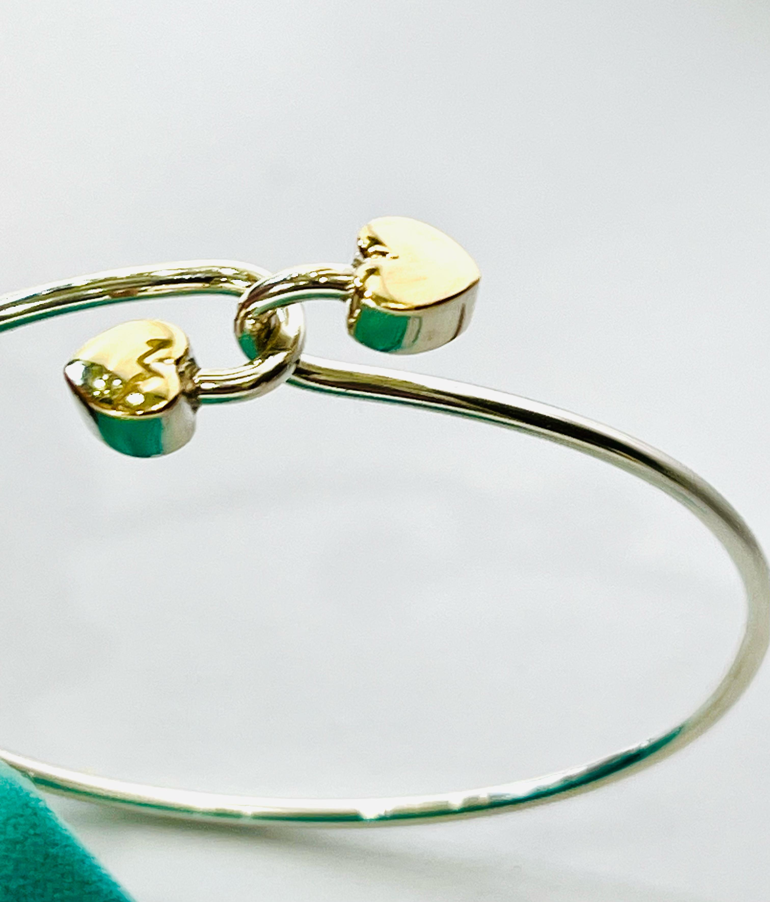 TIFFANY & CO. 18K GOLD AND STERLING SILVER HEART BANGLE BRACELET