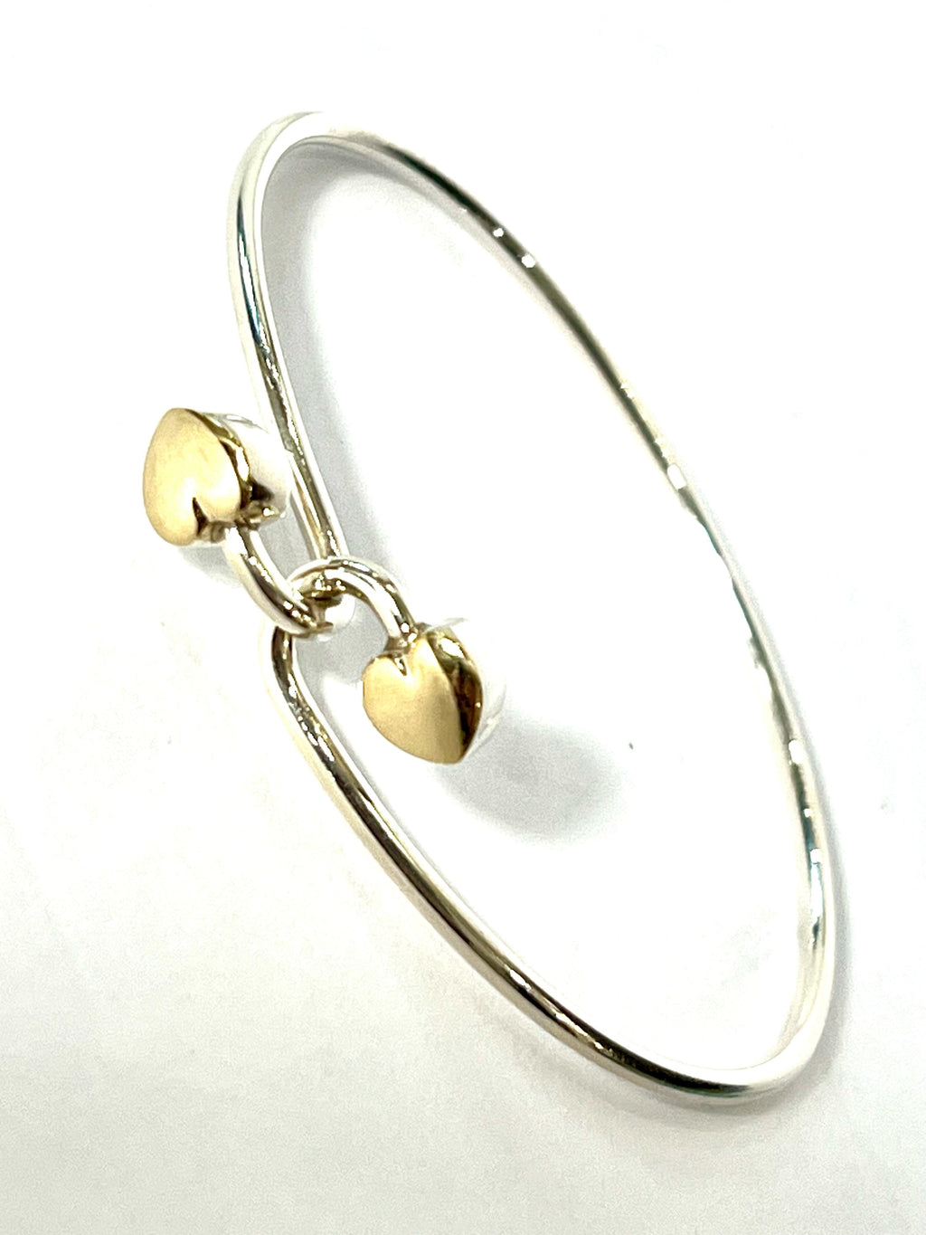 TIFFANY & CO. 18K GOLD AND STERLING SILVER HEART BANGLE BRACELET