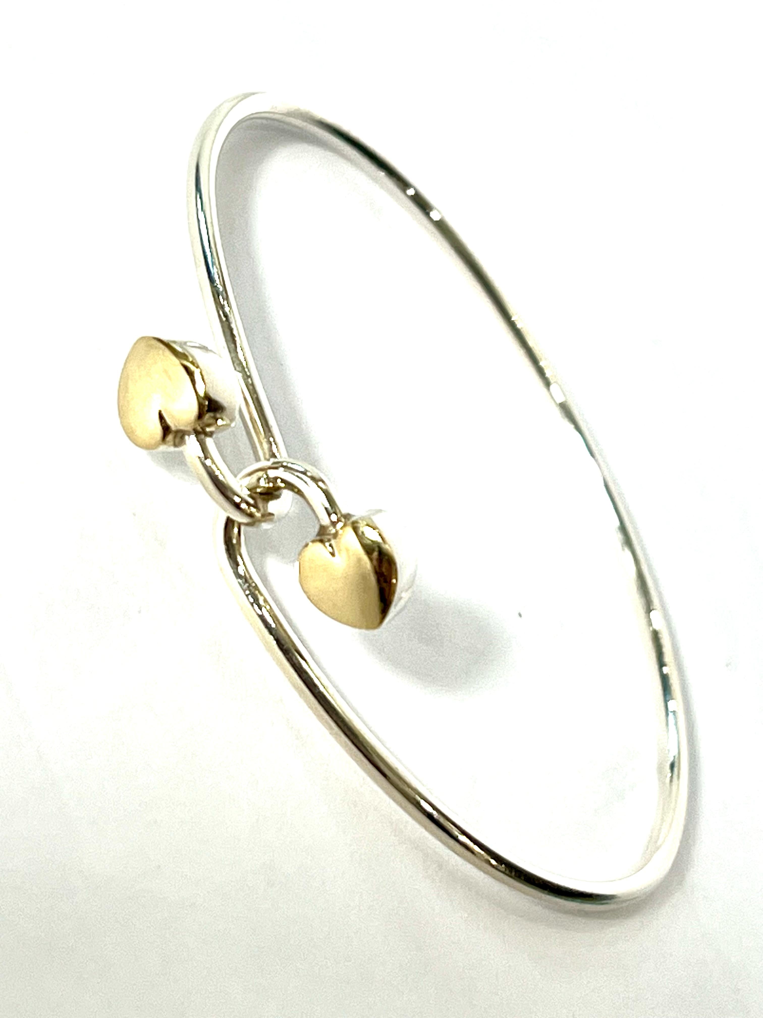 TIFFANY & CO. 18K GOLD AND STERLING SILVER HEART BANGLE BRACELET