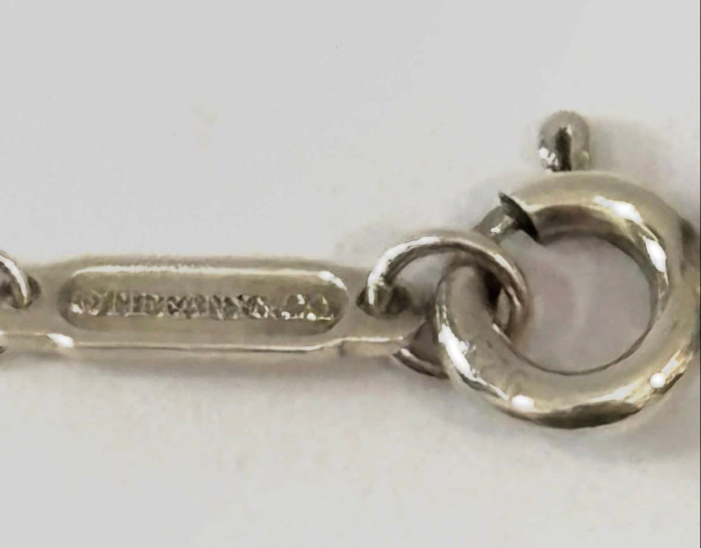 TIFFANY & CO. STERLING SILVER KNOT PENDANT